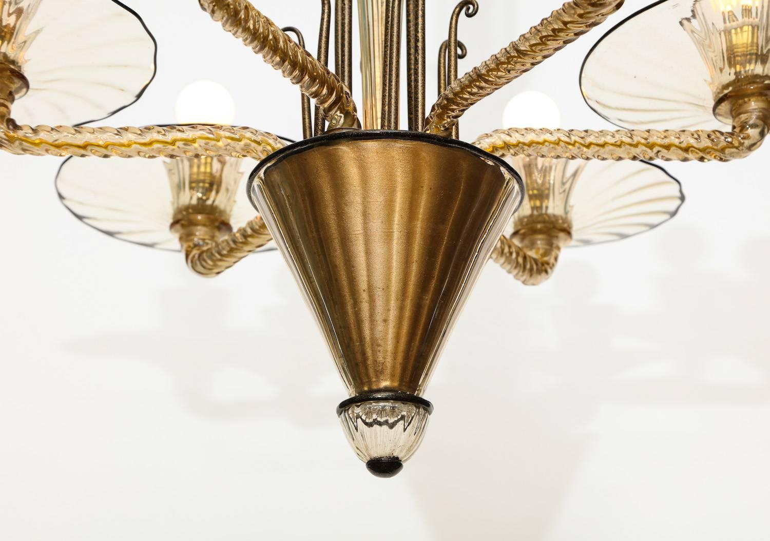 Salviati rare and early six-light chandelier with gilded cups, and gold interior flecks. Twisted and ribbed glass with black trim and black and gold glass detailing. A very fine example of Italian Art Deco realized in Murano glass. Each arm has one