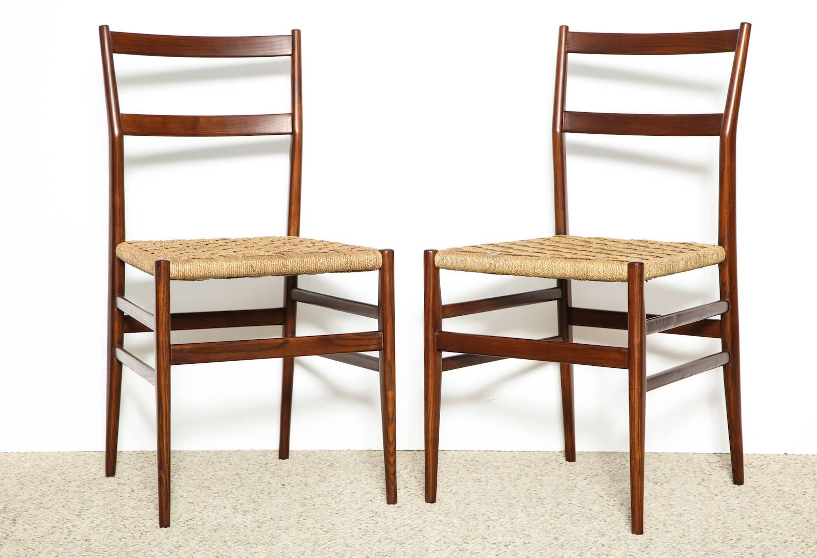 Set of 10 superleggera chairs by Gio Ponti for Cassina. These iconic chairs are one of his most famous models. Sculptural frame of solid ash, with woven seats and slatted backs. Set of ten side chairs with newly woven seats. *Currently only four