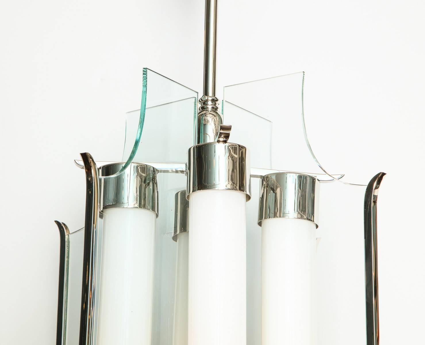 Early and rare hanging light by Pietro Chiesa studio. Elegant fixture of nickelled metal with beautifully machined elements. Clear glass panels and opaque glass tubes. Each tube conceals one standard Edison socket. This fixture comes with a letter