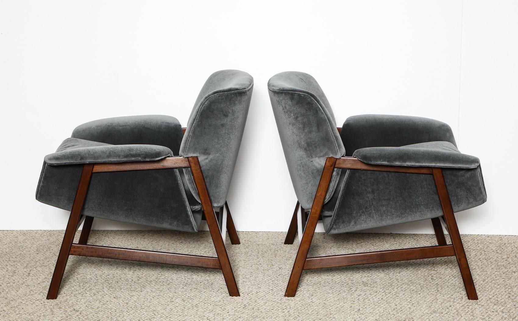 Pair of 849 lounge chairs by Gianfranco Frattini for Cassina. Low lounge chairs with great curves. Dark mahogany architectural structure cradles the upholstered seat and back. A Classic Frattini design, recently upholstered in blue-gray velvet.