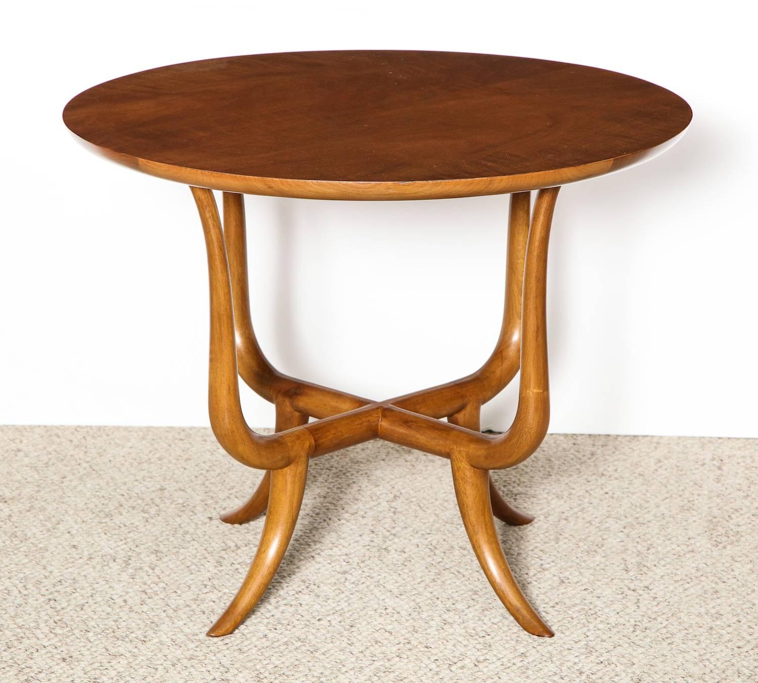 Circular walnut top floating on a solid-walnut dowel structure with four tapering legs. A strong example of Gibbings' custom work in the mid-1950s incorporating a bit of eastern influence. Provenance: Thomas B. Davis Residence - Rancho Mirage,
