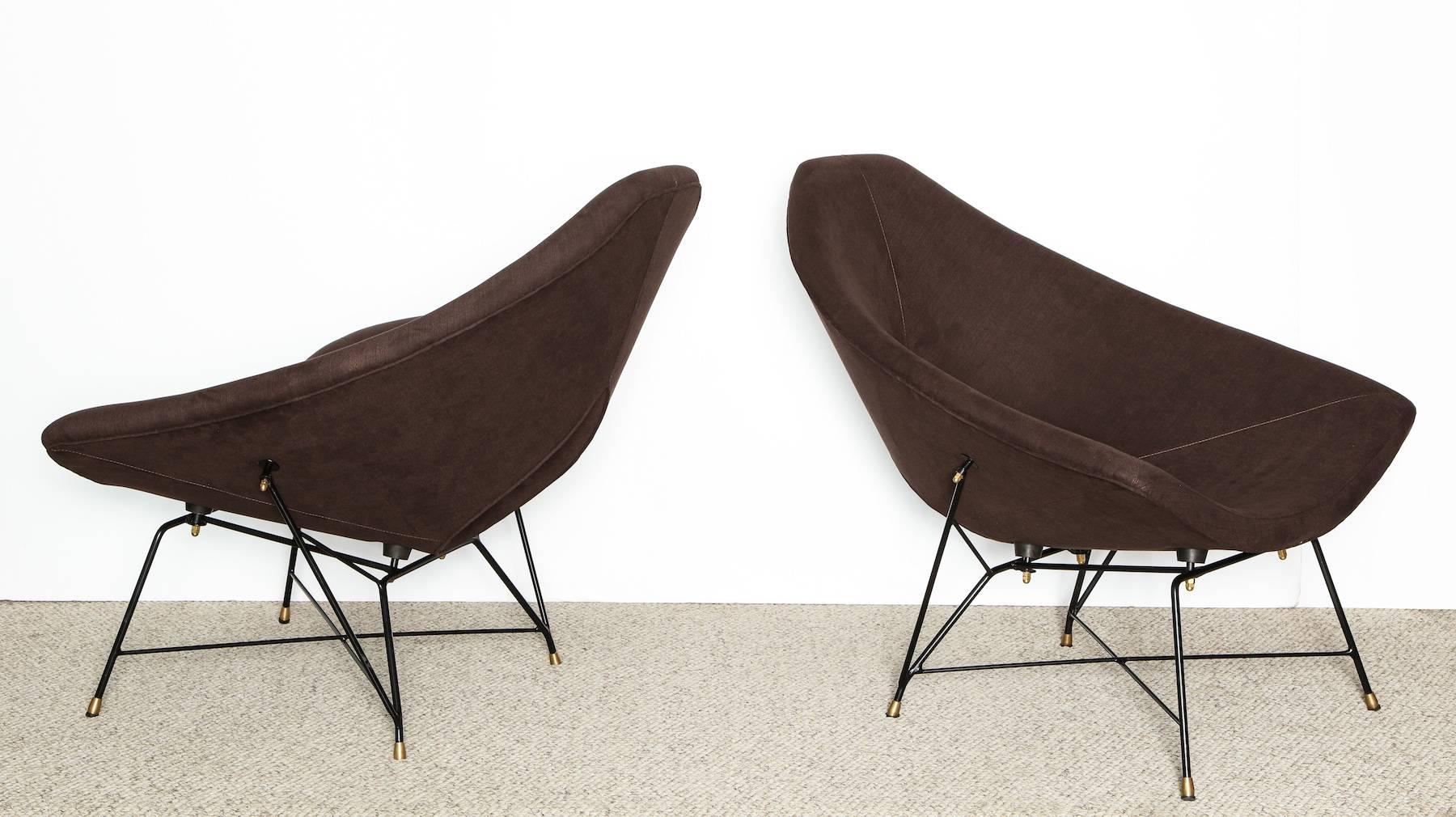 Rare pair of lounge chairs by Augusto Bozzi for Saporiti. Shaped foam over metal. Black-painted metal structure cradles the seat and adds a sculptural element to the overall design. This rare model is part of a series of chairs designed by Bozzi in
