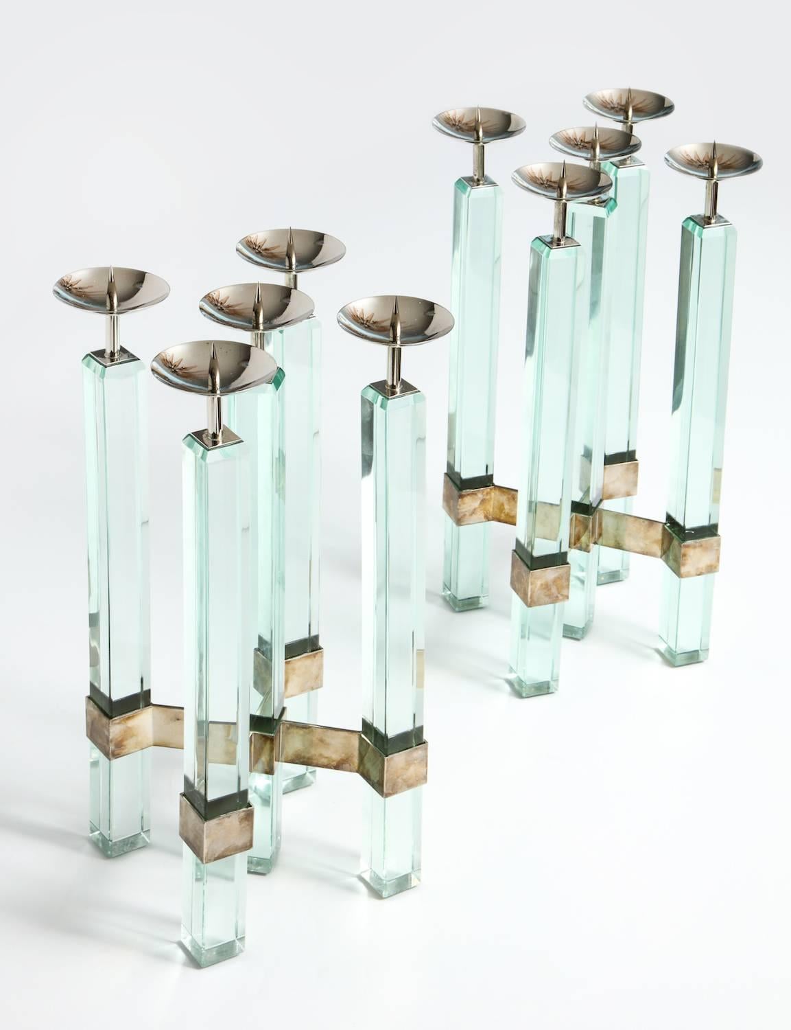 Rare pair of candlesticks, #2422 by Max Ingrand for Fontana Arte. Pair of five-light candlesticks with square solid-glass rods and nickled-brass mounts. Rods joined near the bottom with a metal stretcher. Each candlestick is topped off with a single