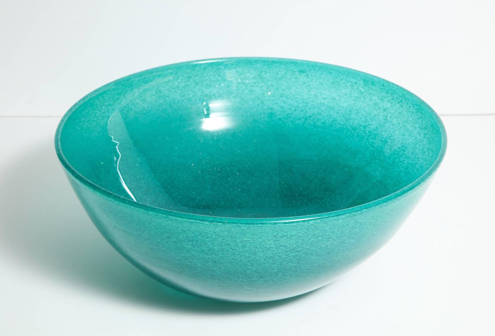 Large-scale Eugenio bowl by Ercole Barovier. Beautiful and large glass bowl of aqua-marine and clear glass with reflective flecks and internal bubbles.