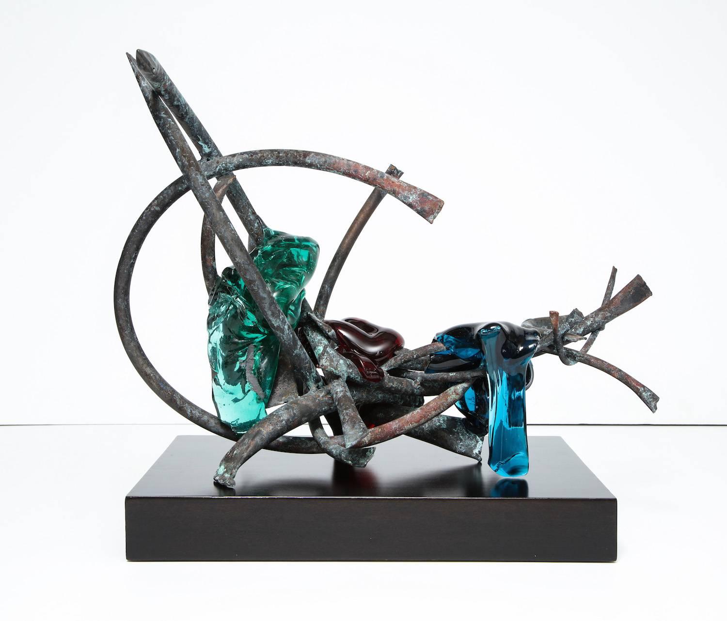 Sculpture by Claire Falkenstein. Copper tubing, molten Murano glass in red, green and turquoise. Dimensions given do not include pedestal.