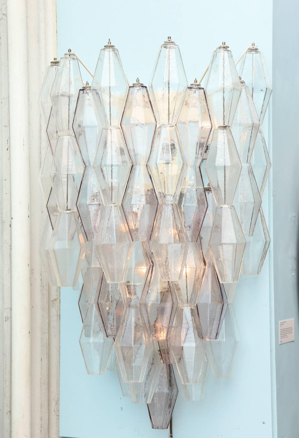 Large-scale pair of Polyhedri sconces by Paolo Venini for Venini.
Beautiful and large fixtures with textured blown glass. Abstract diamond forms with faceted sides hanging from multi-armed interior frame, with 9 standard size Edison sockets per