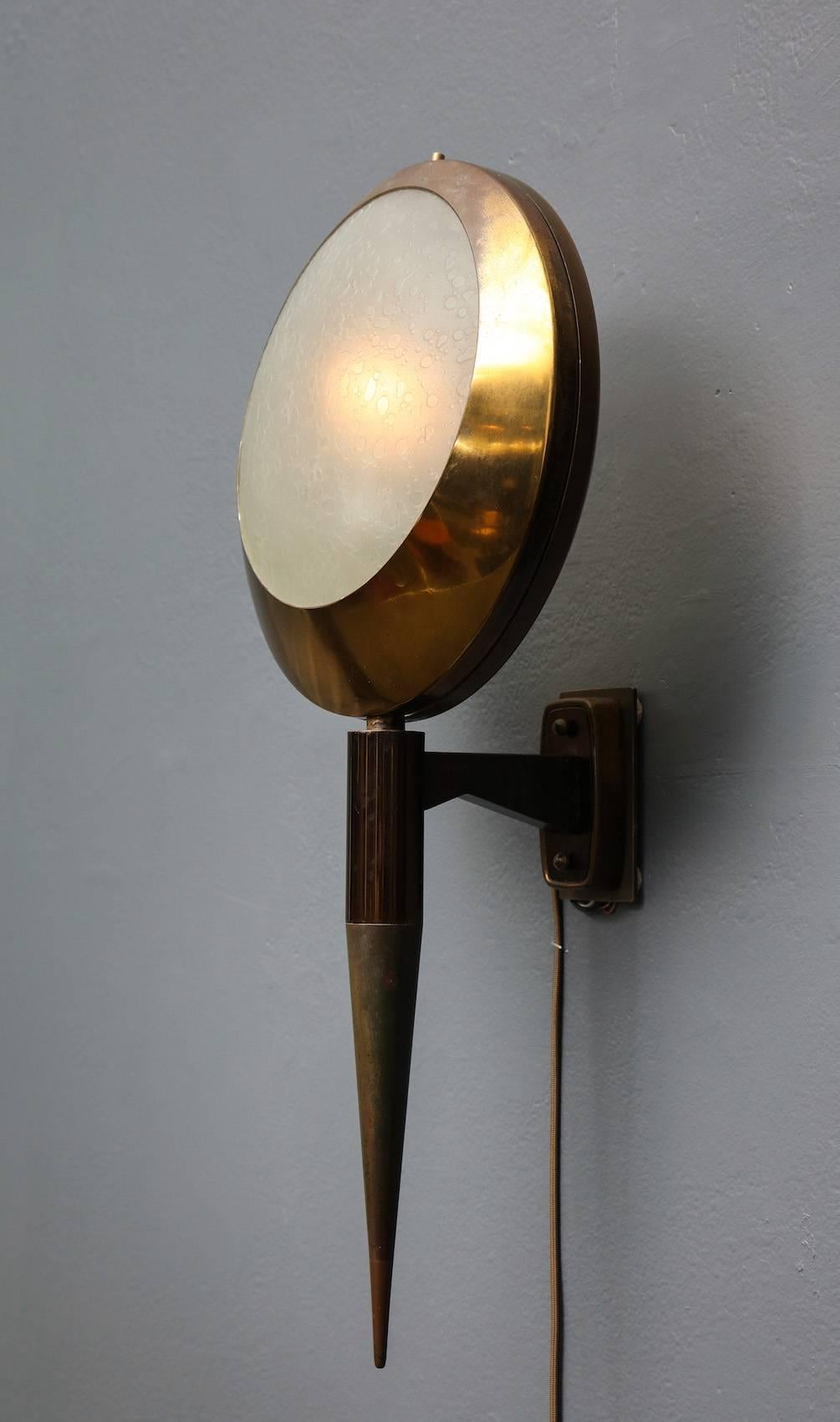 Rare pair of sconces, Model #2128 by Stilnovo.
Polished and burnished brass frames with textured, frosted glass diffuser panels on front and back. 1 standard size socket per sconce. New backplates created to conform to US J-box. Patination and