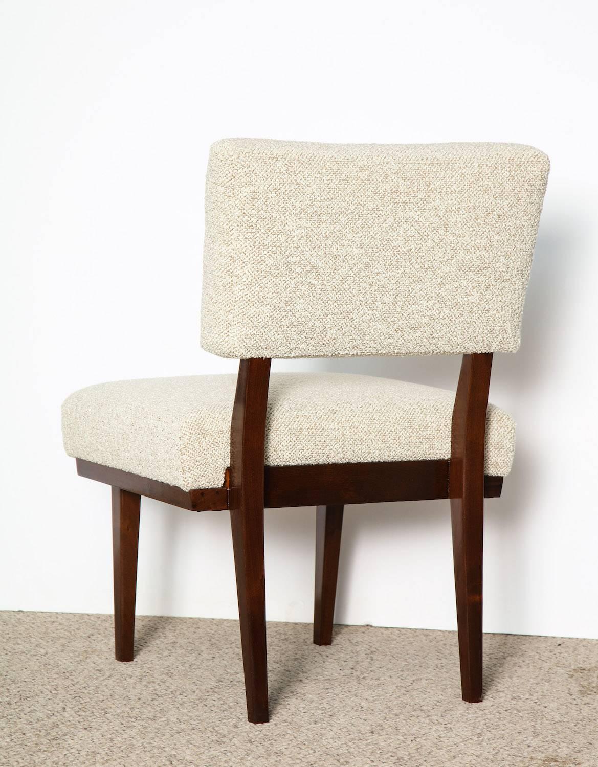 Custom slipper chair by James Mont.
Great architectural design of mahogany frame with recent boucle upholstery. This chair is slightly lower than a standard desk chair and a great height for a dressing table.