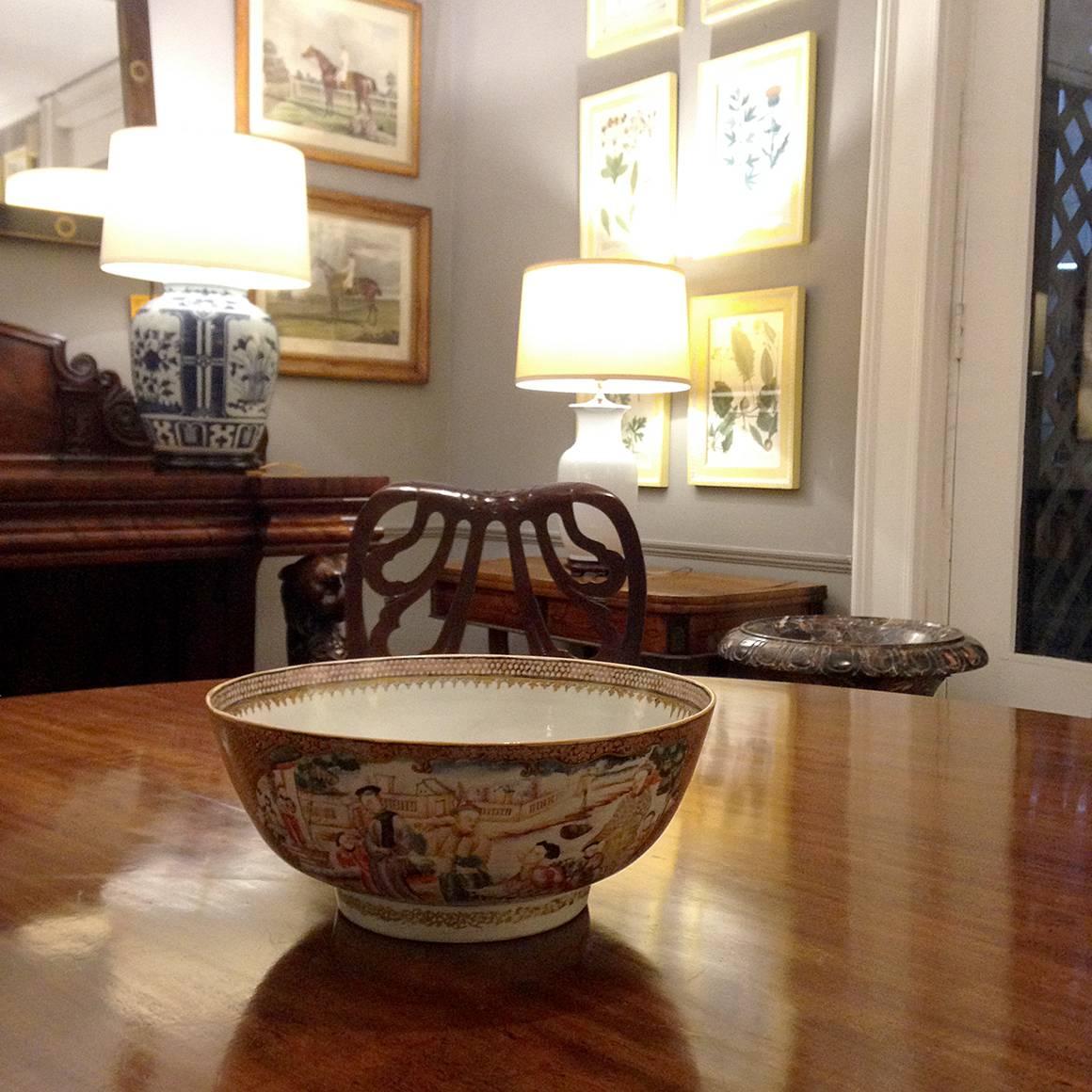 This finely decorated Qing-period rose medallion or rose mandarin bowl is beautifully hand-painted with four vignettes depicting courtly scenes.