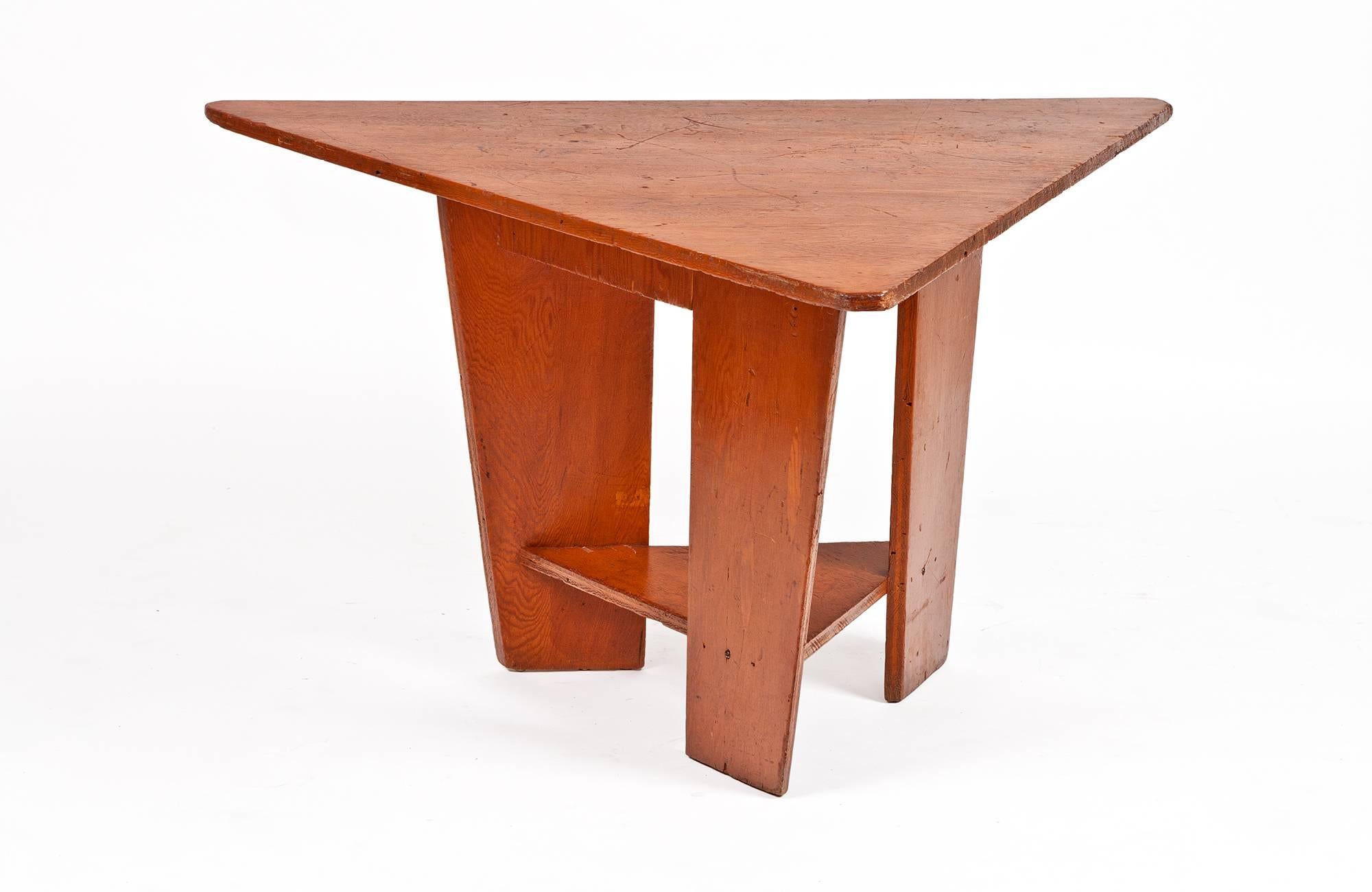 This trio of hinged bench seats and one table were designed by Frank Lloyd Wright and completed in 1951 for the Unitarian Meeting House, which Wright also designed, at 900 University Bay Drive, Shorewood Hills, Madison, Wisconsin. The components of