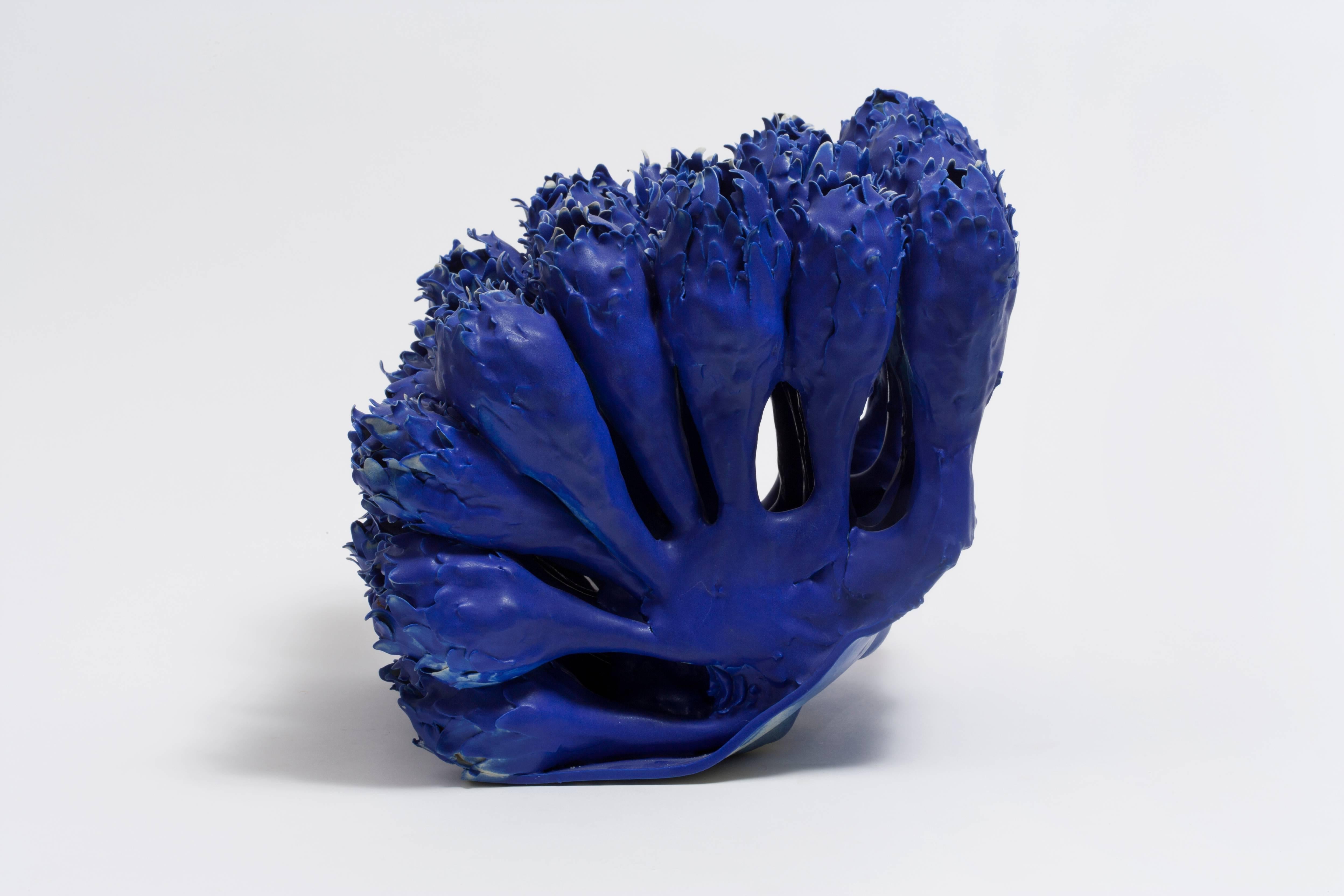 Blue porcelain sculpture of artist-interpreted flowers.

Anat Shiftan (Israeli, American, b. 1955)
Flowers in blue, 2016
Porcelain
Measure: 11 H x 11 D x 13 W inches.
 