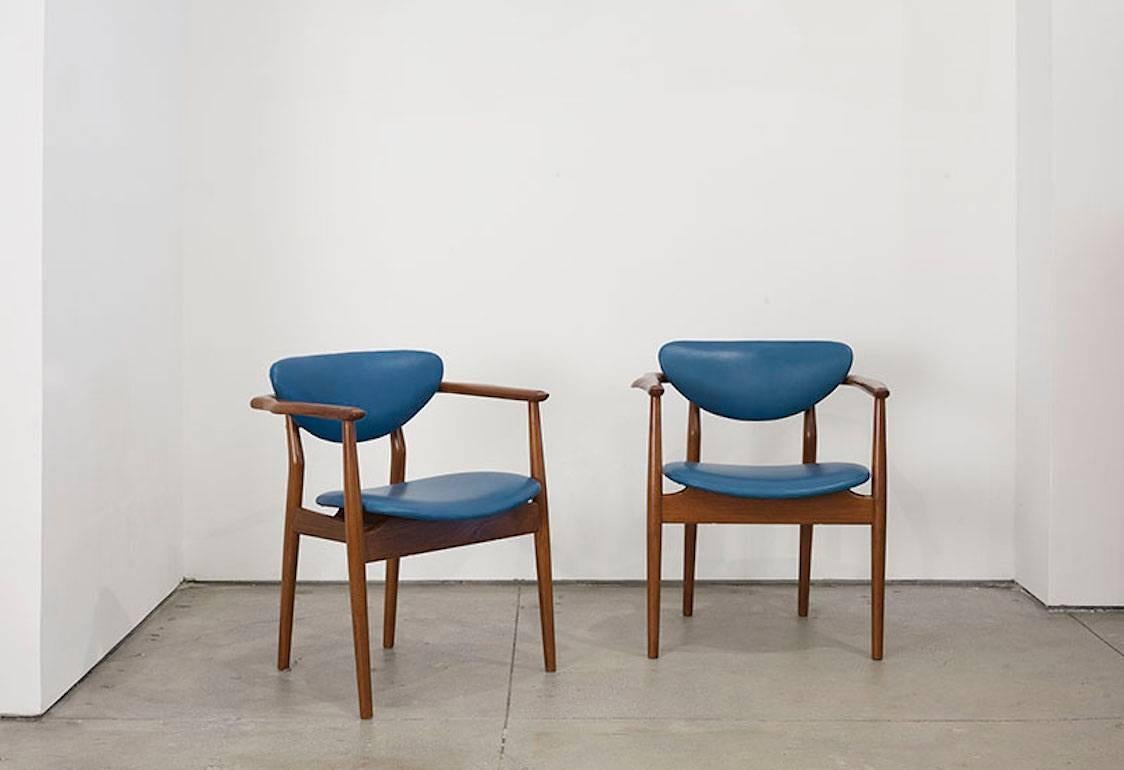 Beautiful rare pair of armchairs by Danish architect Finn Juhl. This pair was produced by Niels Vodder, circa 1946.
Teak is in beautiful condition with new leather upholstery.

Measures: 28.5