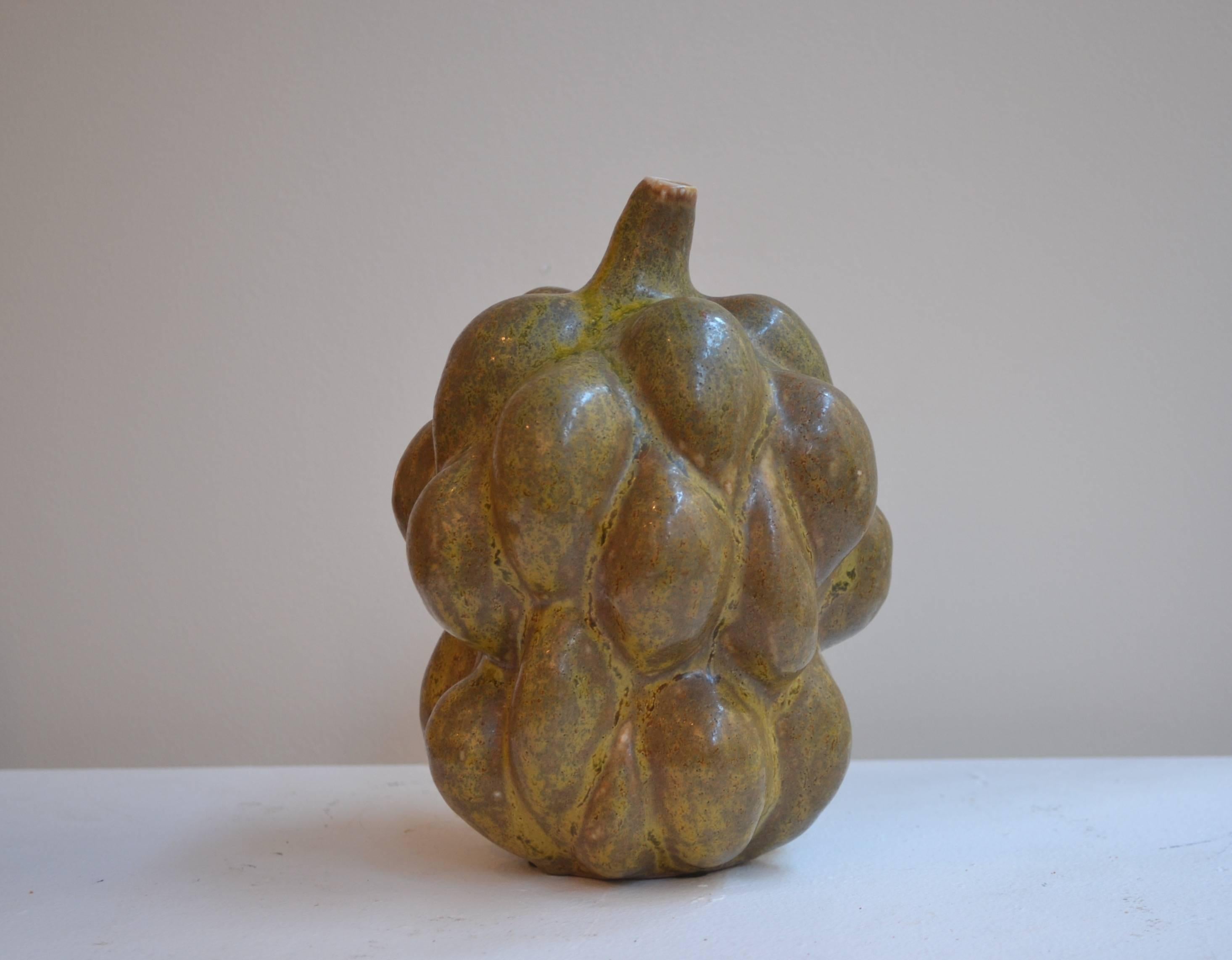 Axel Salto rare fruit form vase with stem in solfatara glaze. Made by Royal Copenhagen, Denmark, circa 1955. 
Measure: 8.50
