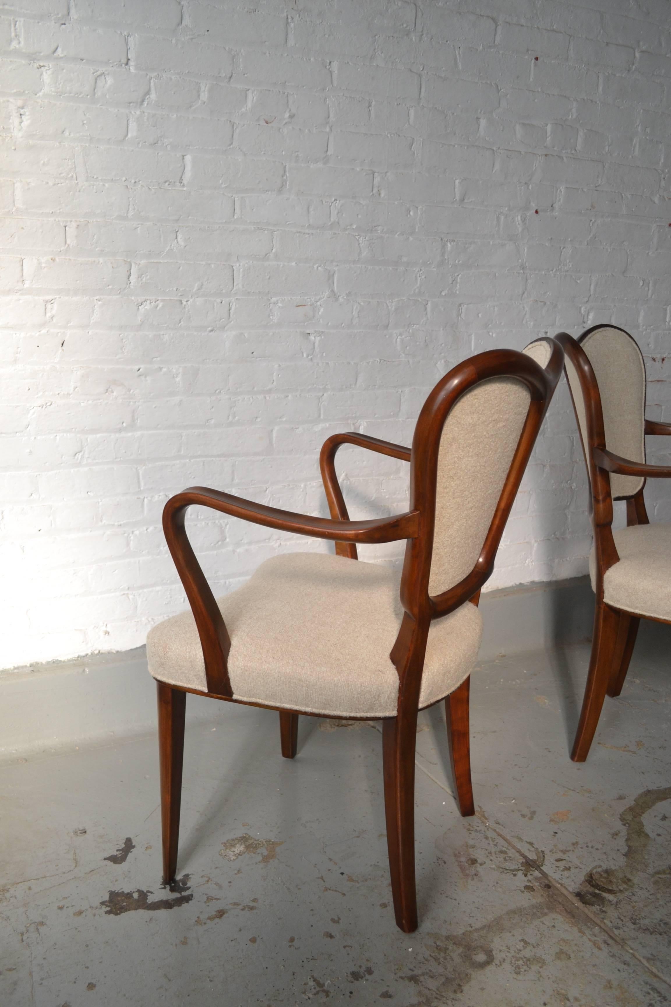 Gustaf Axel Berg (1891-1971) Sweden.
Set of four armchairs.
Flamed birch, new upholstery.

Measures: 20” W x 18” D x 35” H (back), 27” H (arm).
 