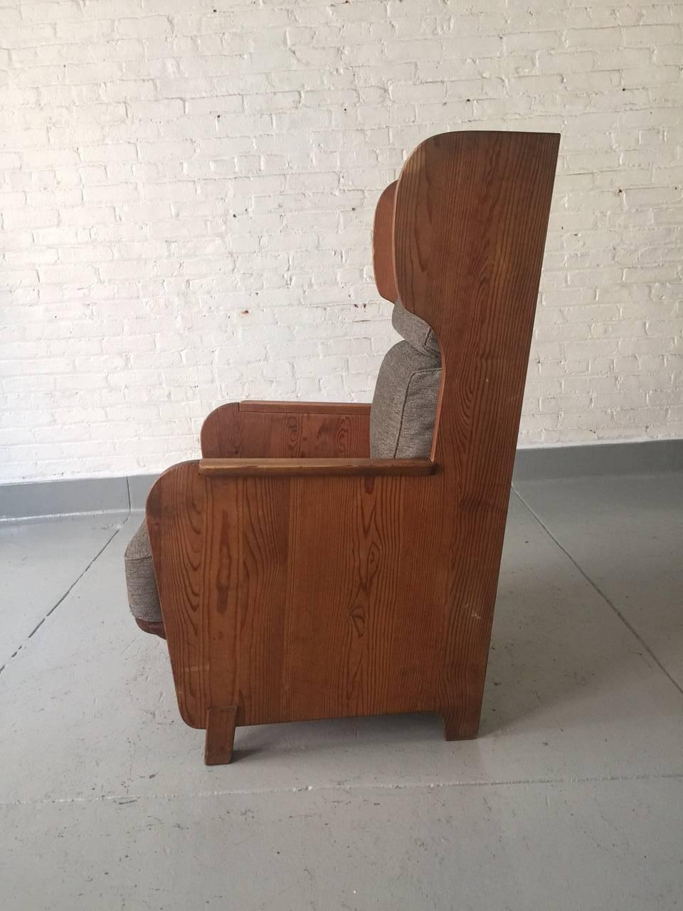 High back lounge chair by Axel Einar Hjorth for Nordiska Kompaniet, circa 1932.
Newly upholstered as originally designed.
Solid pine.
Measures: 43
