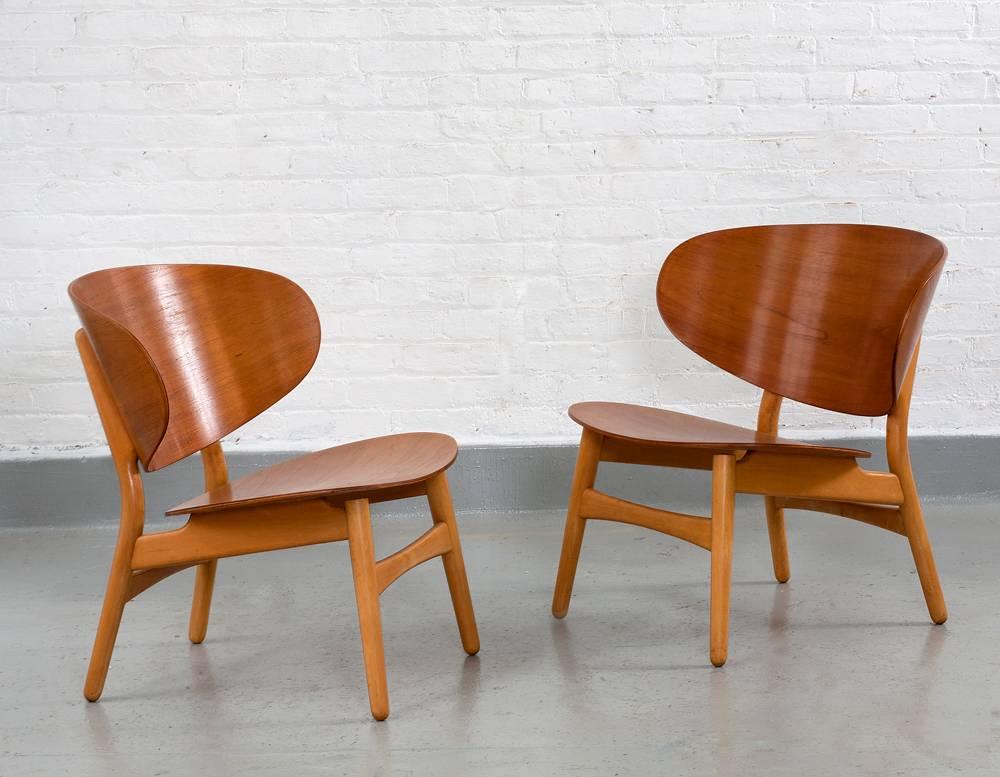 Perfect condition, no scratches or marks. 

Hans Wegner
Shell chairs and shell loveseat
Denmark, circa 1940
laminated teak shells mounted to beech frames
Chairs: 27.5" H x 24" D x 27" W
Seat Height: 15.25"
Loveseat: 27.5" H
