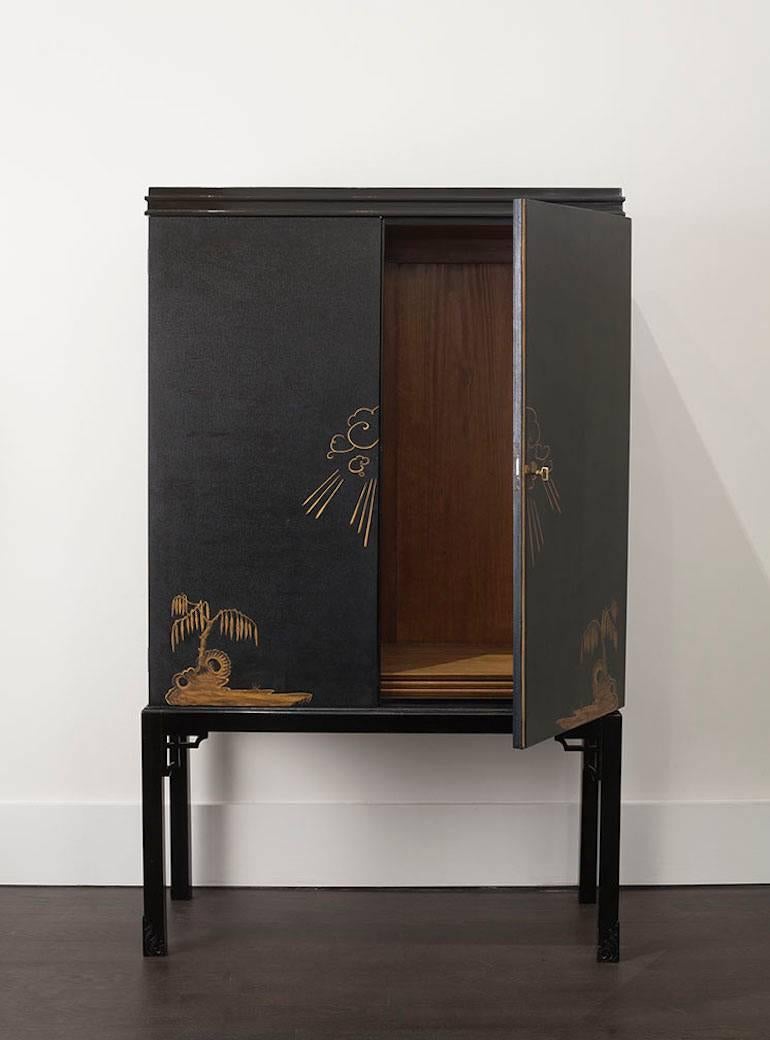 A rare lacquered and darkened birch cabinet with beautiful detailing of Asian motifs. Made circa 1930s in Sweden. Comes with three shelves and original key, in excellent condition. 

Anonymous (Sweden)
Cabinet, Sweden, circa 1930
Lacquered and