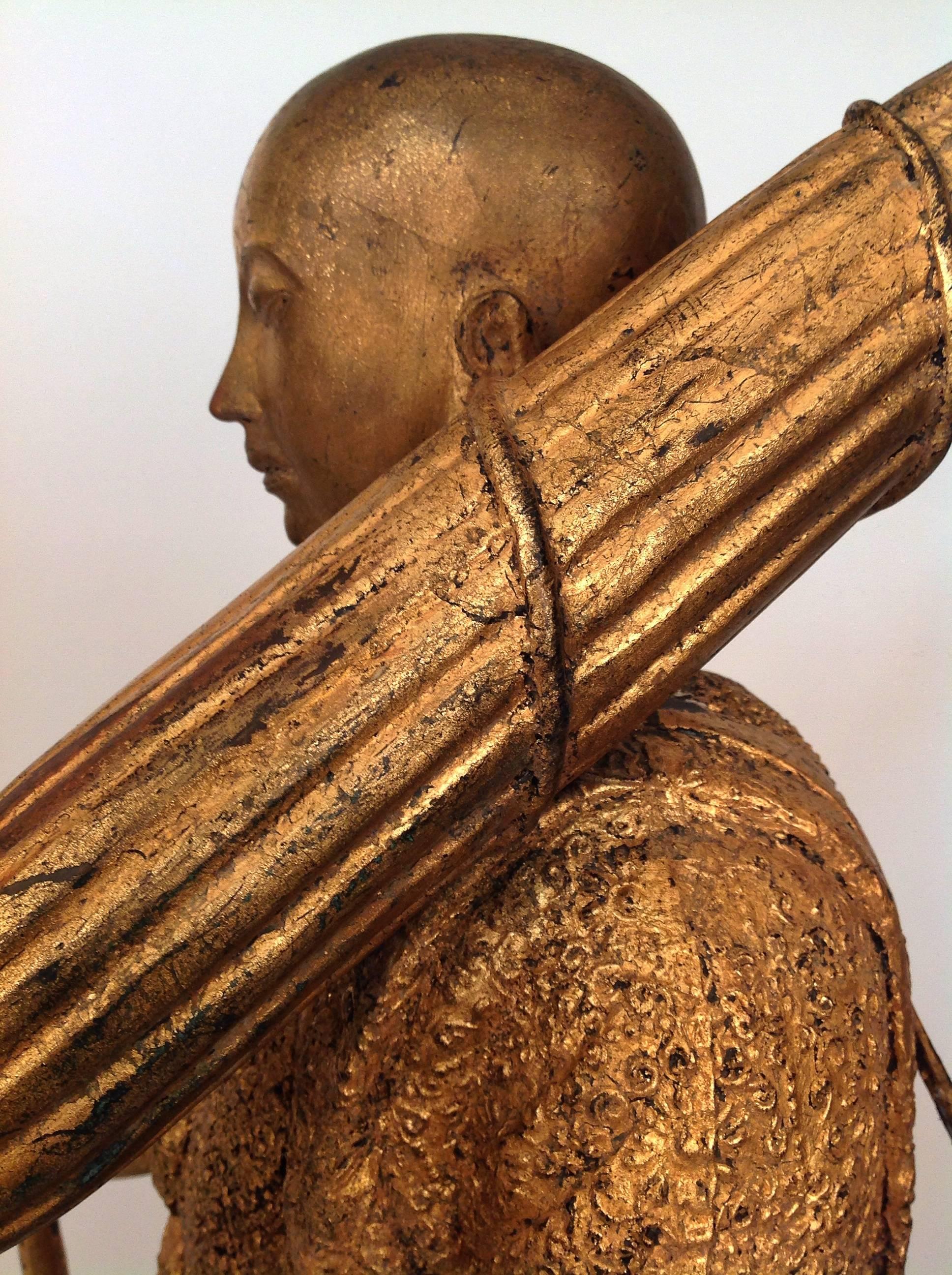 A gorgeous, solid cast bronze with gilt traveling monk in walking pose, with alms bowl, umbrella, naga walking staff and satchel.