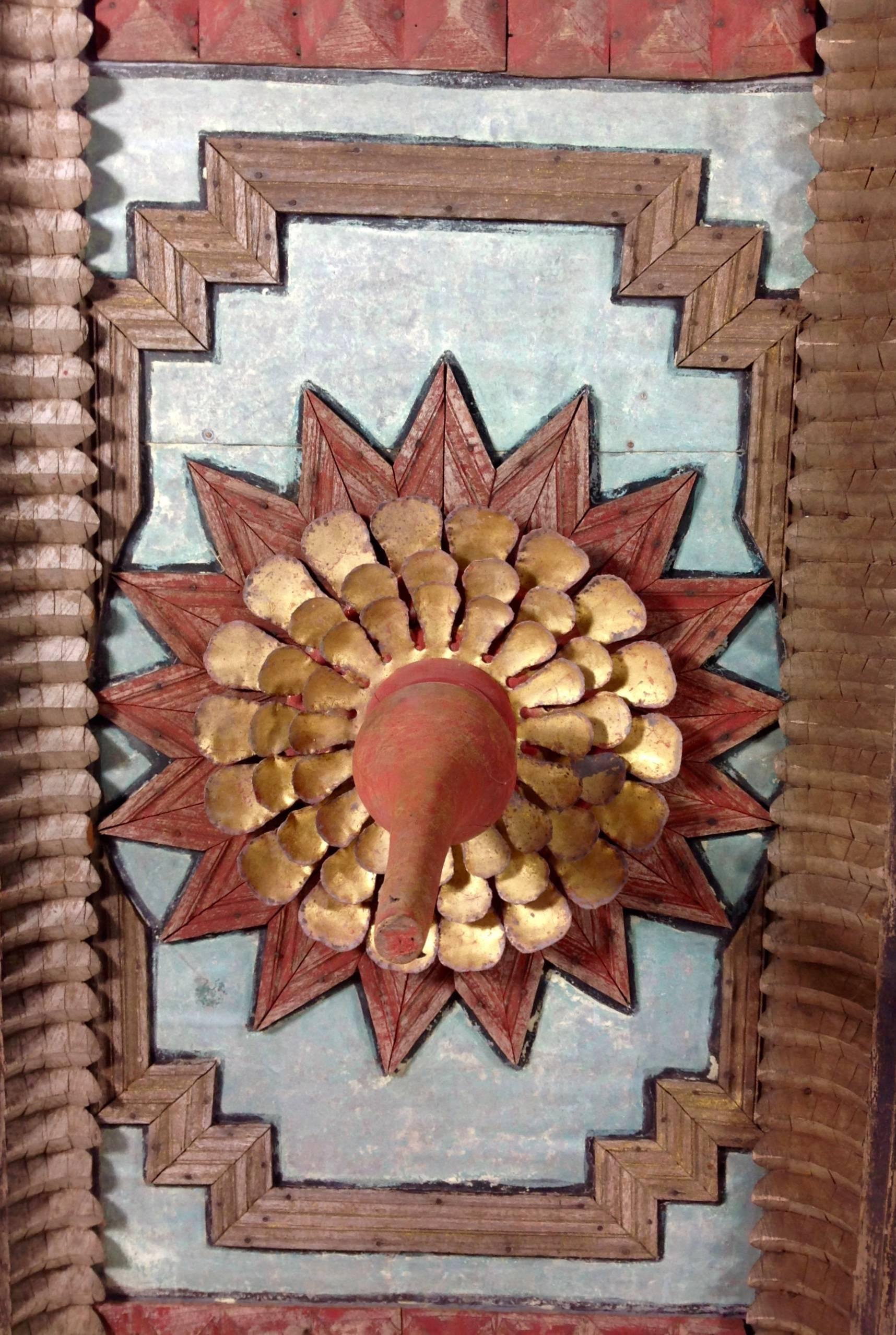 An exceptional hand-carved and painted Burmese ceiling panel with lotus center.