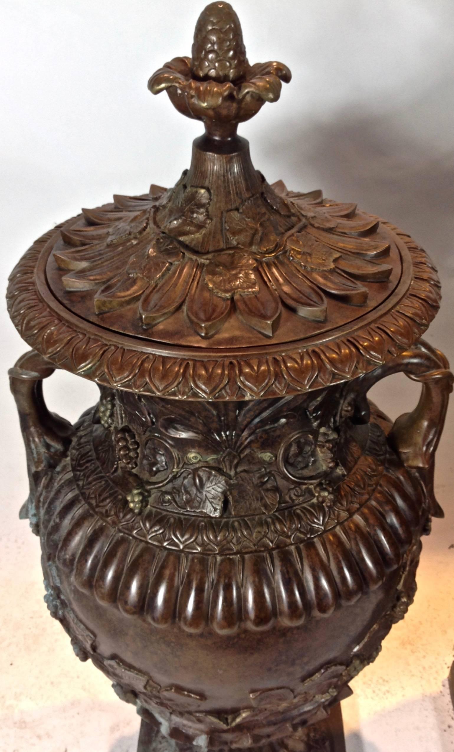 An exquisite pair of large bronze lidded urns by California design icon, Luciano Tempo.