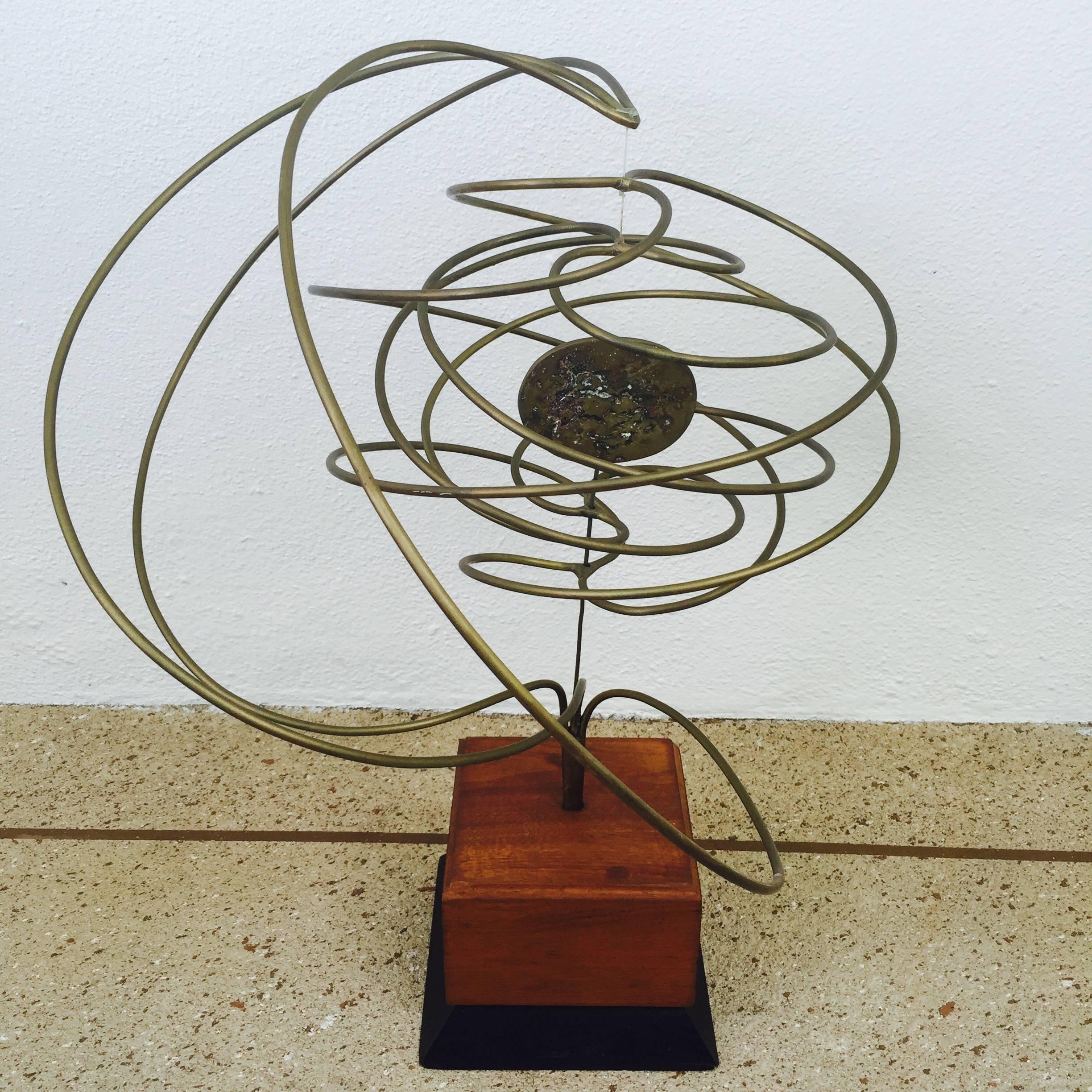 A kinetic sculpture of brass signed and dated by Michael Cutler.
Early works by Cutler were done in brass which makes this rare.
He later worked mostly in steel.
Fantastic Brutalist in style "pendulum" which is very of the