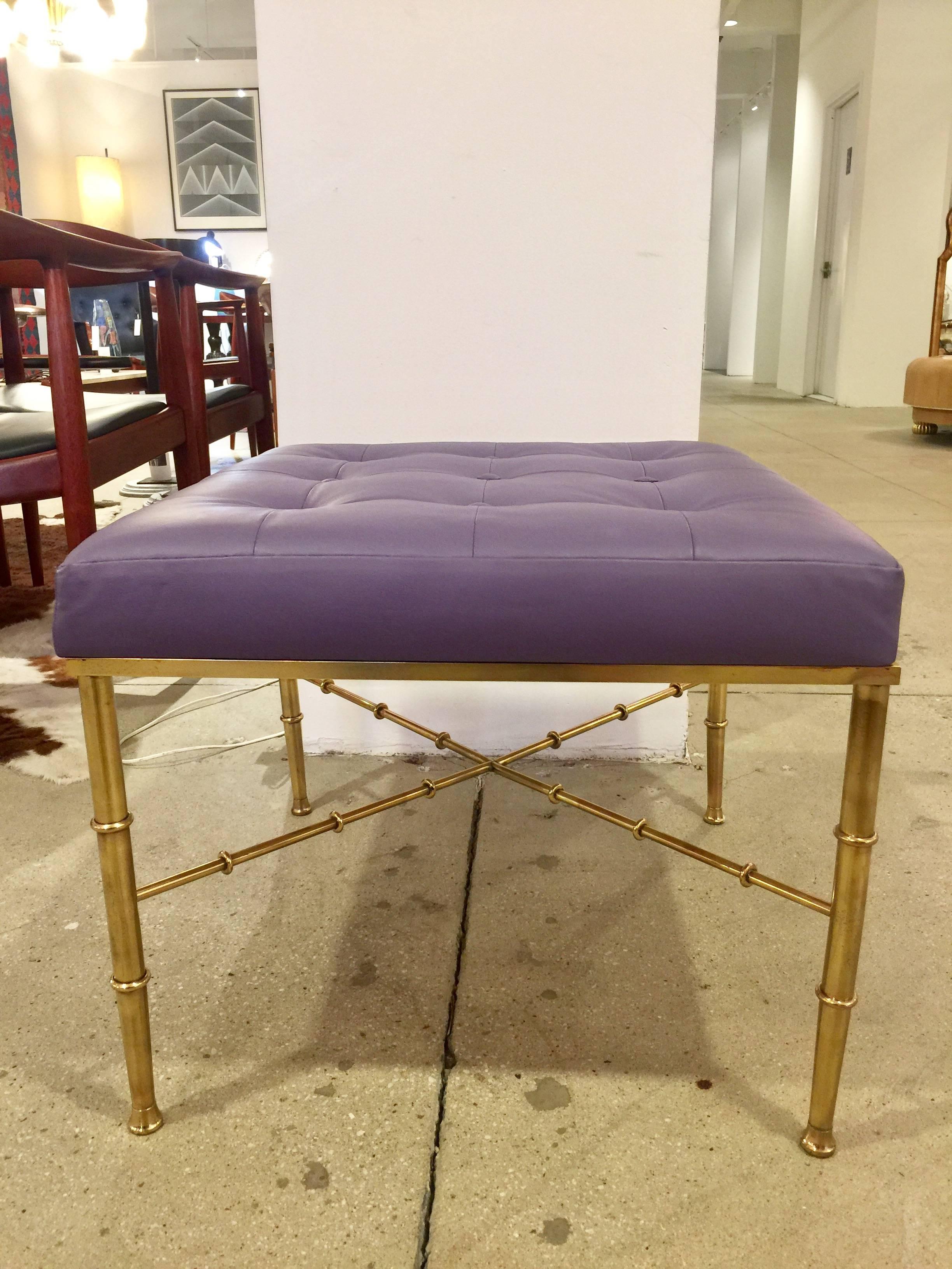 A beautifully designed bench having a faux bamboo brass base.
Modernized and complimented with a tufted leather upholstery
Elegant and modern in design.