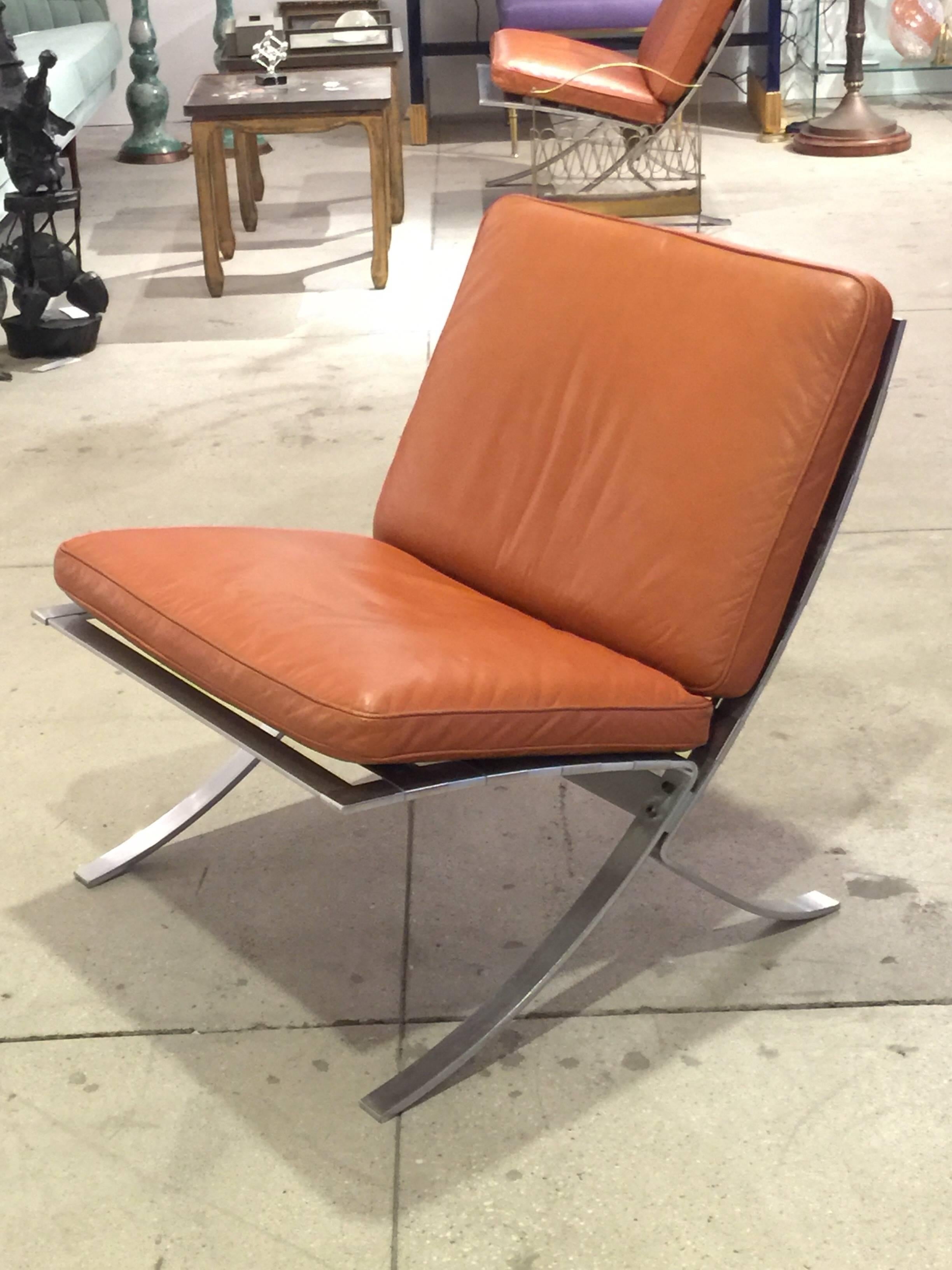 Pair of Mid-Century Modern leather chairs with original upholstery in very good condition. Beautiful steel frame with. Perfect size chair for a lounge or living room area. Not too heavy to move around.