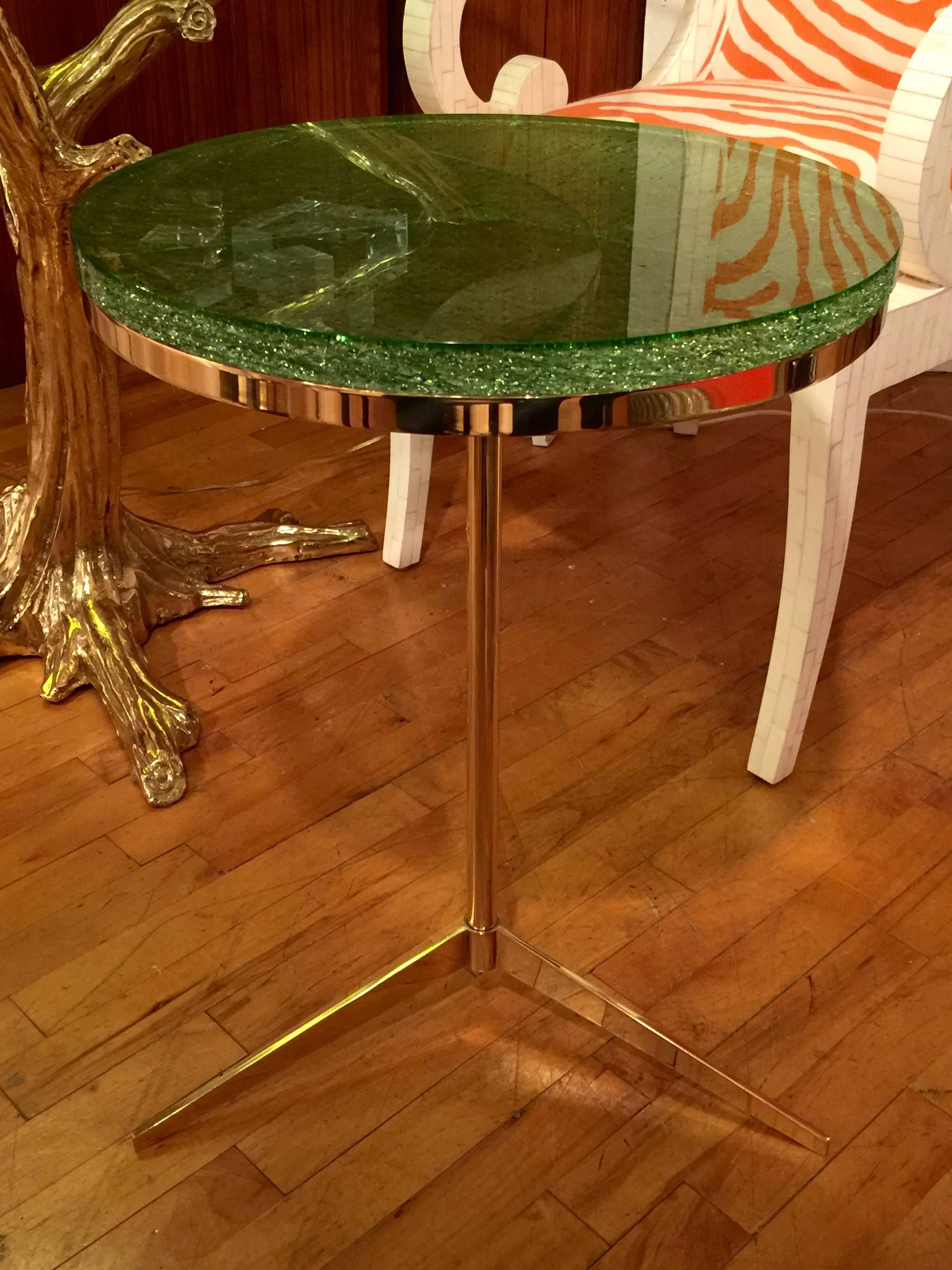 A brass tripod table in the style of Paul McCobb.
An elegant and modern design 
Table has been finished witha custom lucite top and recently polished
Beautiful combination of colors.
Great scale.