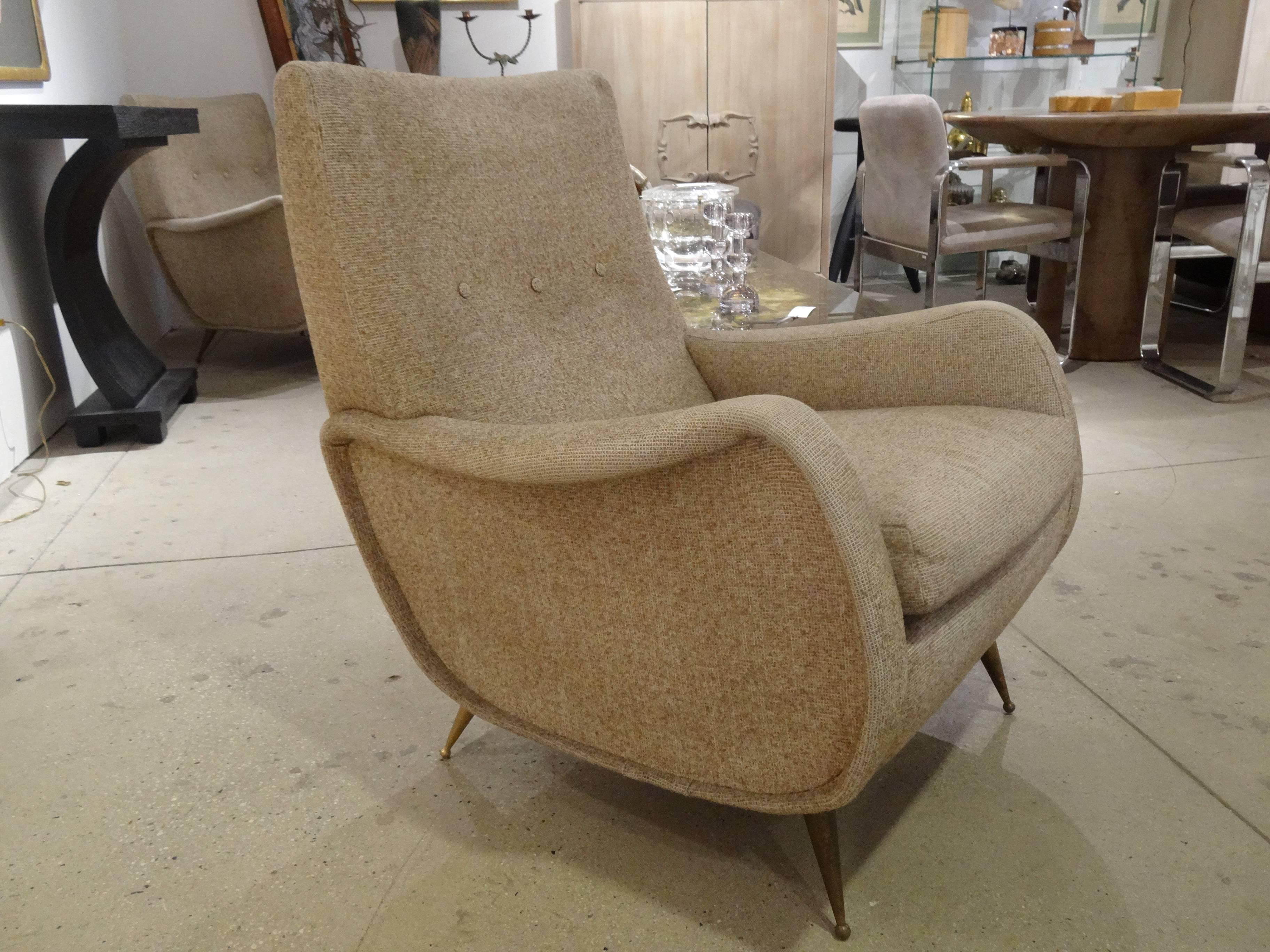 Pair of Mid-Century Modern Italian club chair with nice brass feet. In vintage condition. Wear on fabric.