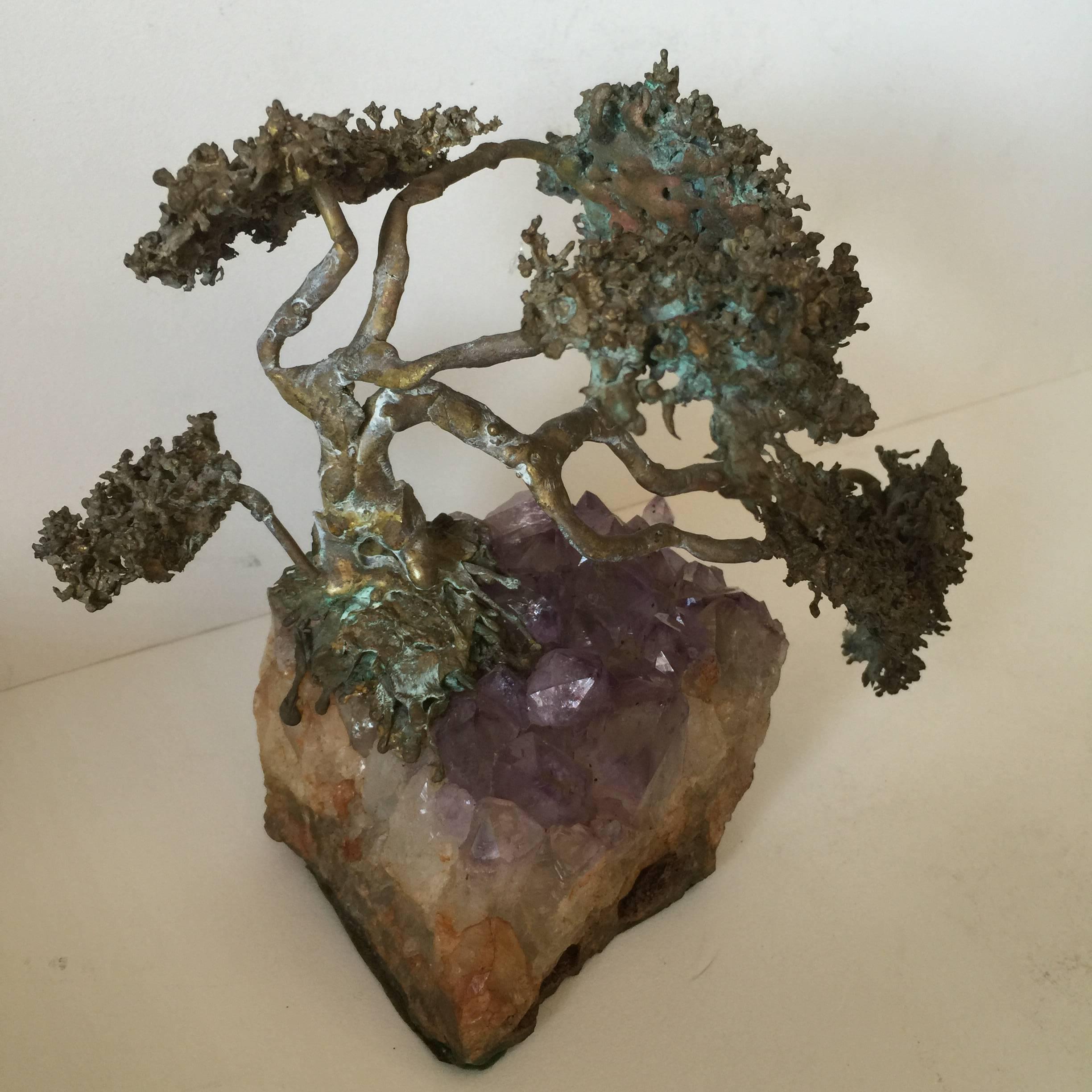 A metal Brutalist in style bonsai tree sculpture mounted on a 