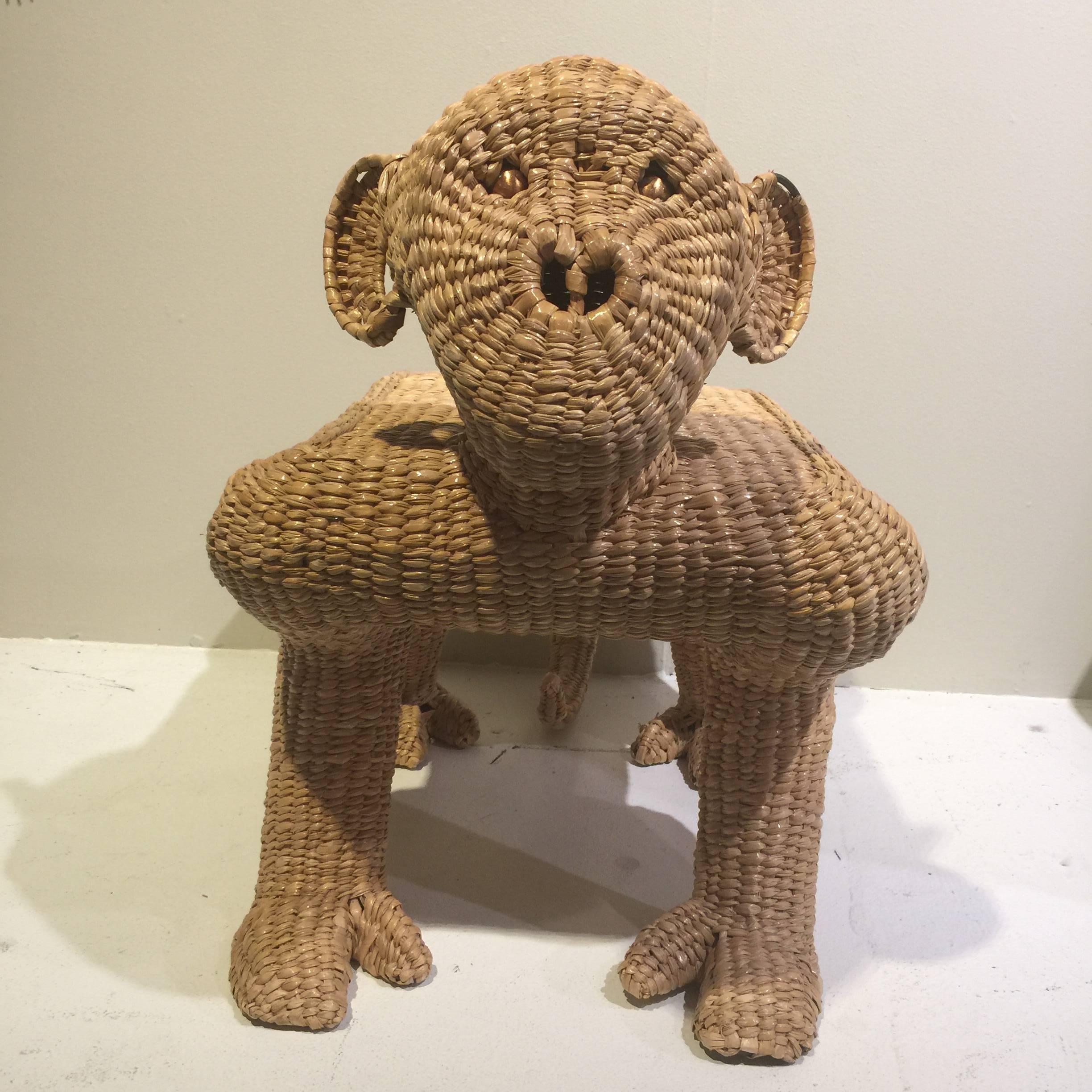 A vintage wicker monkey ottoman of wicker by Mario Lopez Torres.
Piece has metal label.
Small amount of wicker missing by ear. See pic.