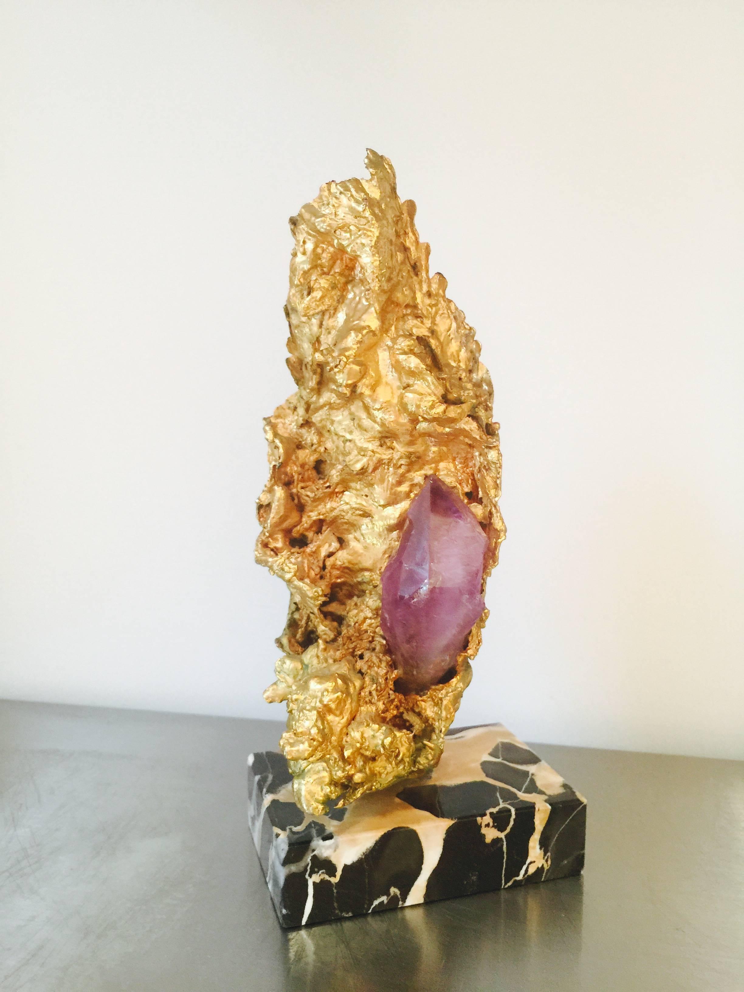 A beautiful mixed material sculpture in the style of Mjacques Duval Brasseur.
Great use of the gilt metal in the Brutalist style.
The inset amethyst quartz adds elegance and dimension to this piece.
Mounted on a marble base.
 
