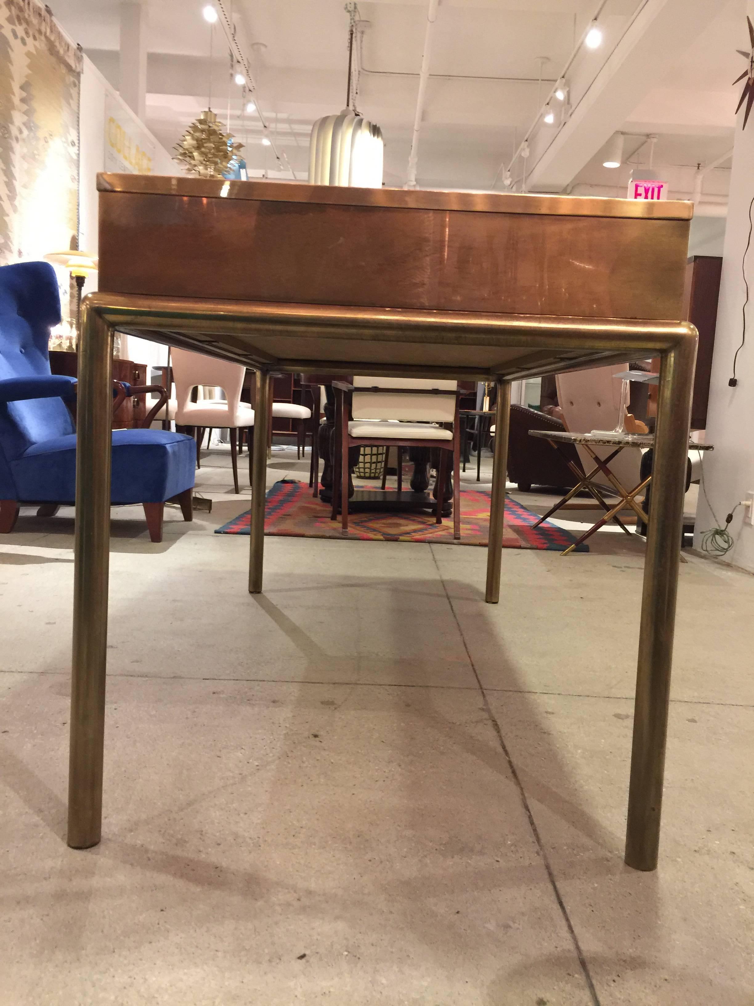 A beautiful brass and leather desk by Bernhard Rohne for Mastercraft.
Beautiful simple design exuding elegance with the rich use of materials and combination of them.
The hand stained leather compliments the brass finish.
Incredible hardware adds