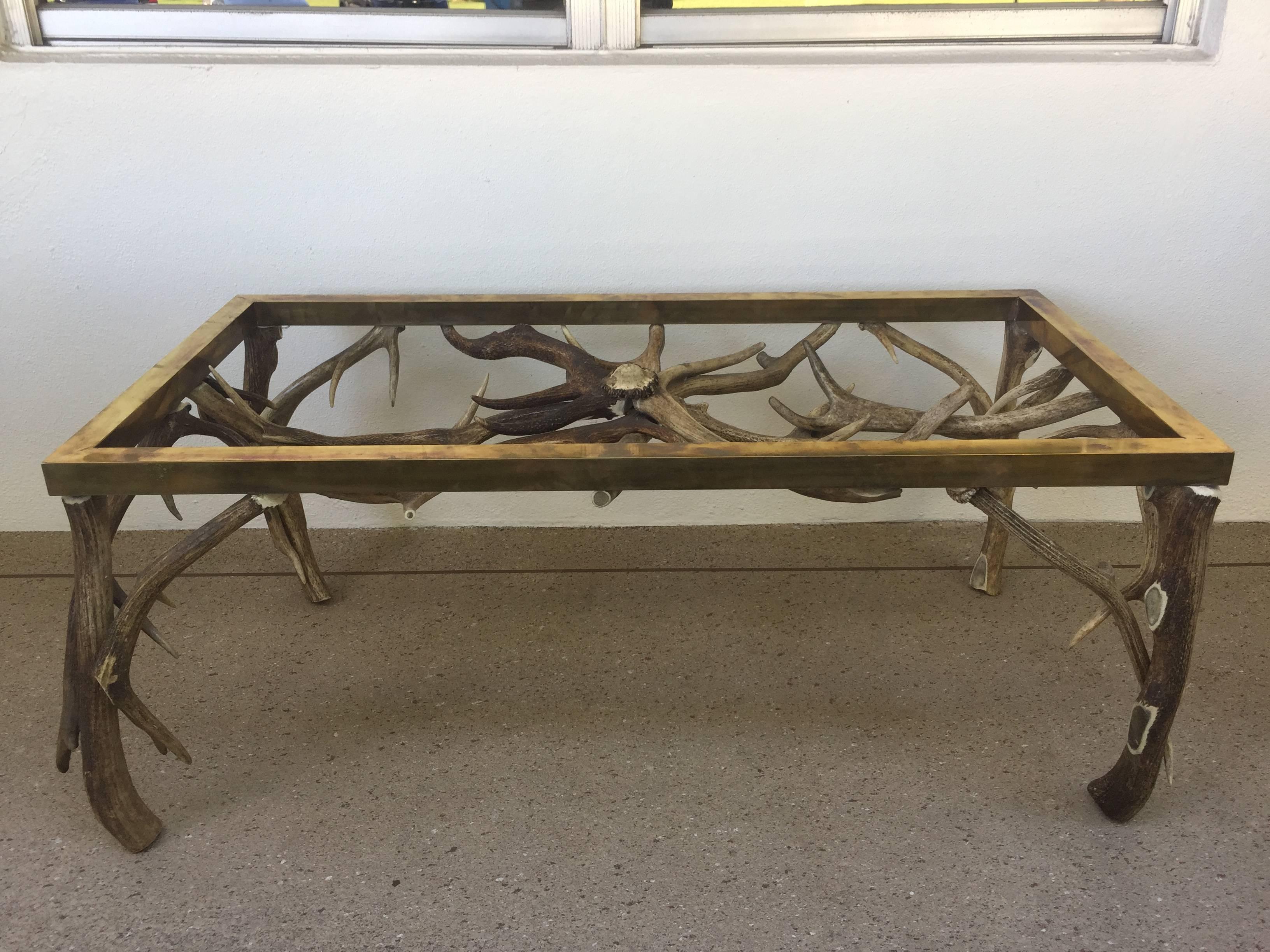 A coffee table having a base which jas been formed from antlers and topped with a brass frame.
These piece is in the manner of Anthony Redmile.
Glass top will be provided and fits the too to exact measurements of brass frame.
Great use of