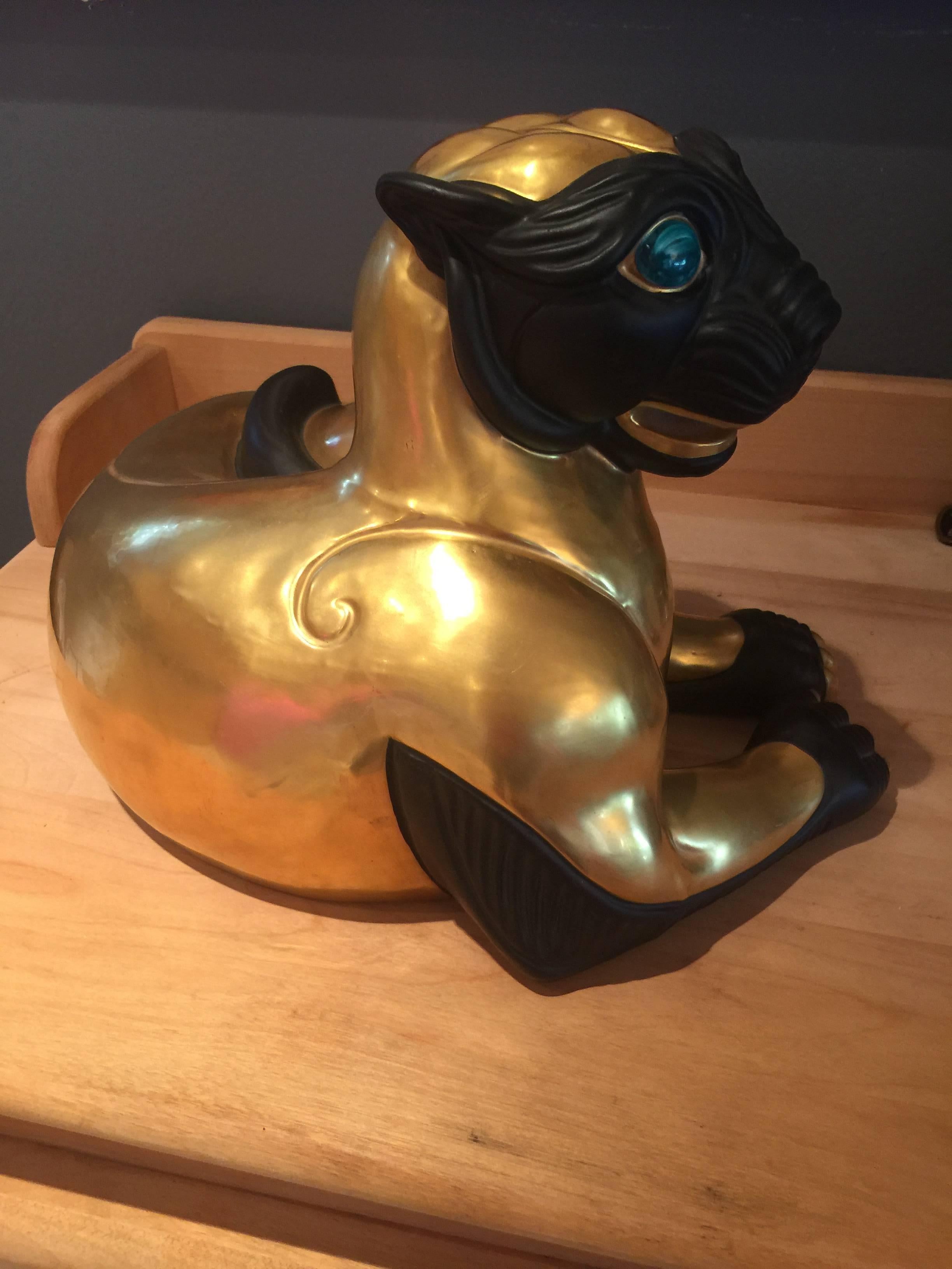 A rare gilded and unglazed masked and gloved cat by Manifattura Artistica Porcellane
The most beautiful combination high gloss gilded glaze and unglazed face masc and paws of black.
The lapis finished eyes add the elegance and exotic appeal of