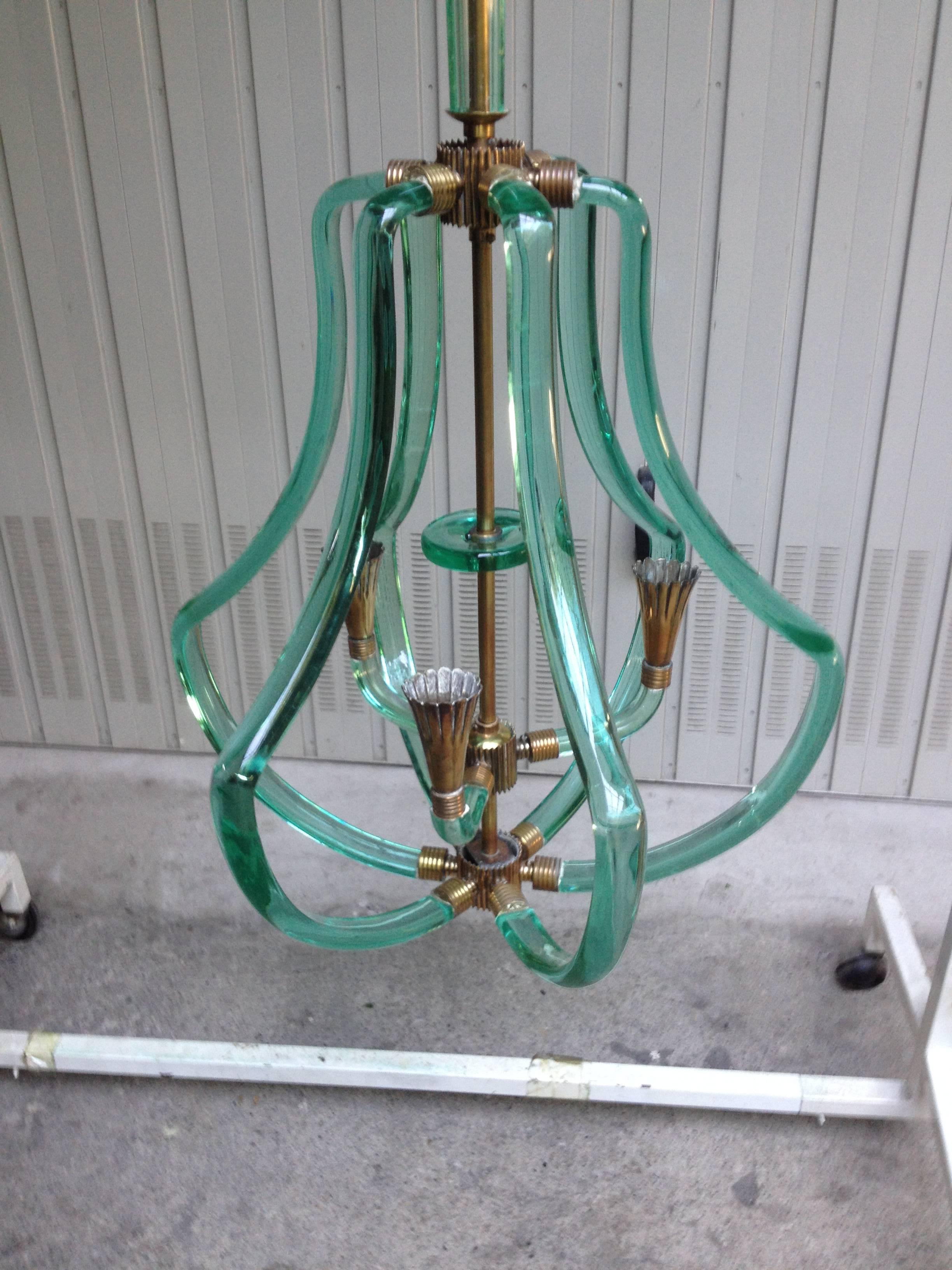 A most unusual and fantastic Italian glass chandelier, made by Seguso, Murano, circa 1948. 
Incredible form and use of glass and brass.
Simply elegant and a fine example.
Please email for exact measurements.