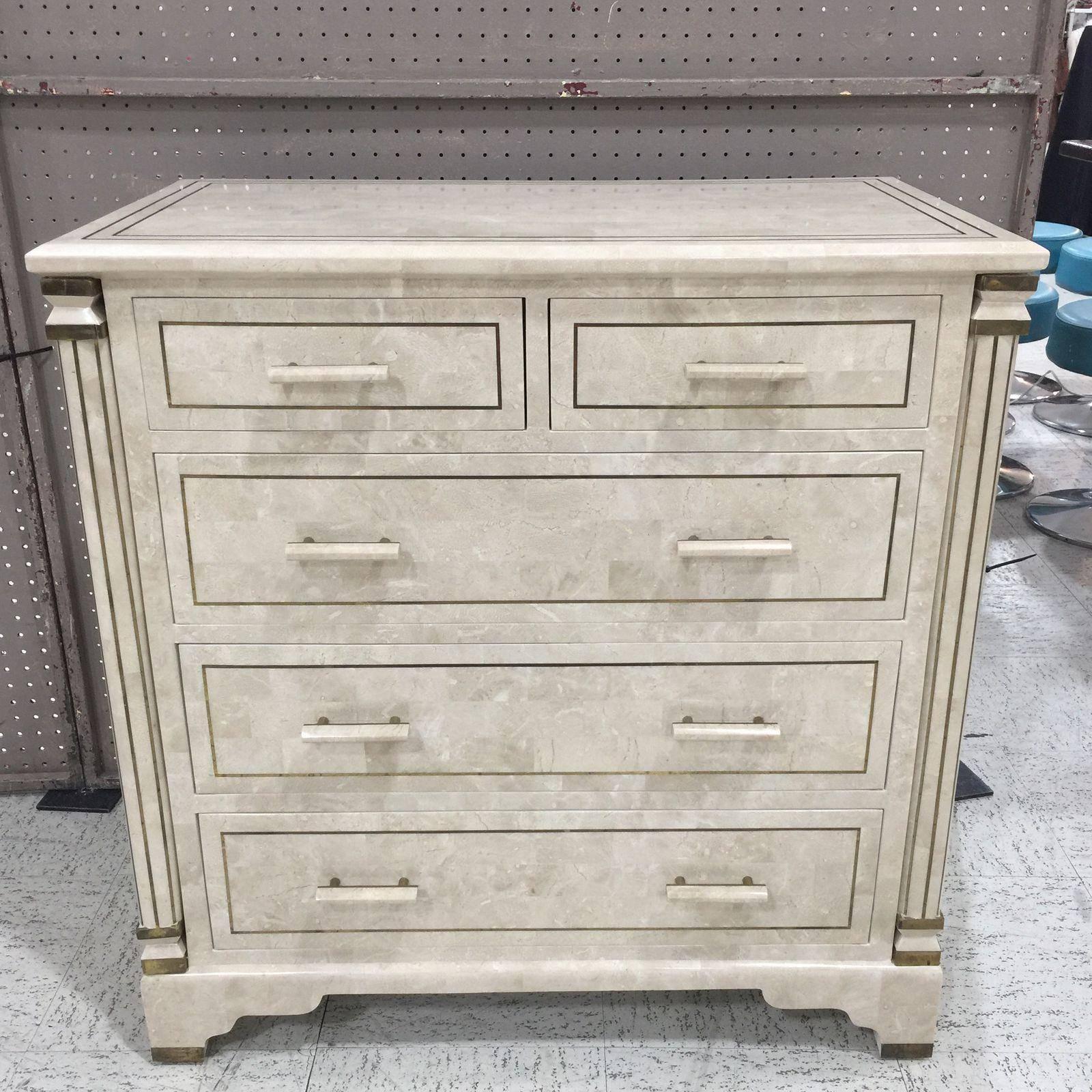 A neoclassical inspired chest of tessellated stone and brass inlay.
tone on tone stone gives this piece a clean modern look.
Great brass accents which highlight the form and design of this piece
fantastic scale and size.
 
