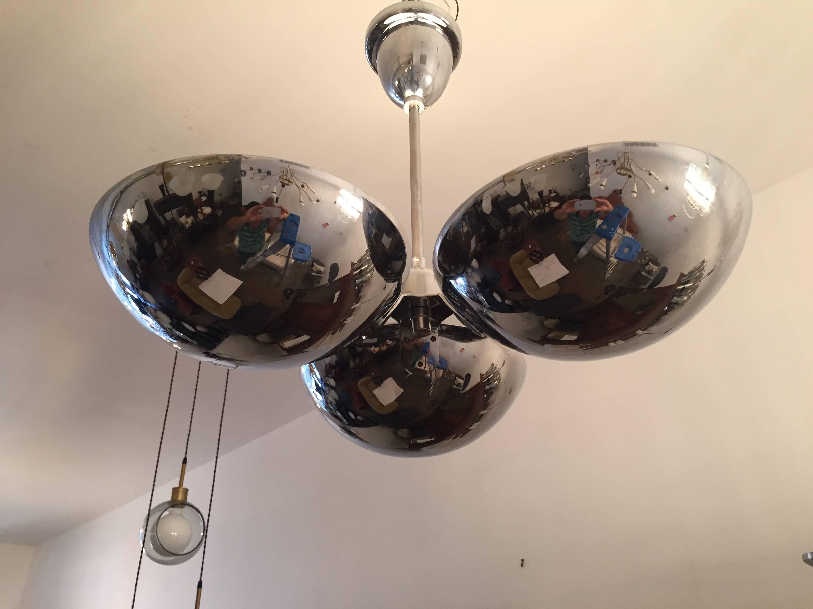 A great 1930s Bauhaus polished chrome flush ceiling light or hanging pendant. The fixture is composed of three half domes each with a porcelain 120w light socket. All rewired. Ceiling pole can be shortened or lengthened.