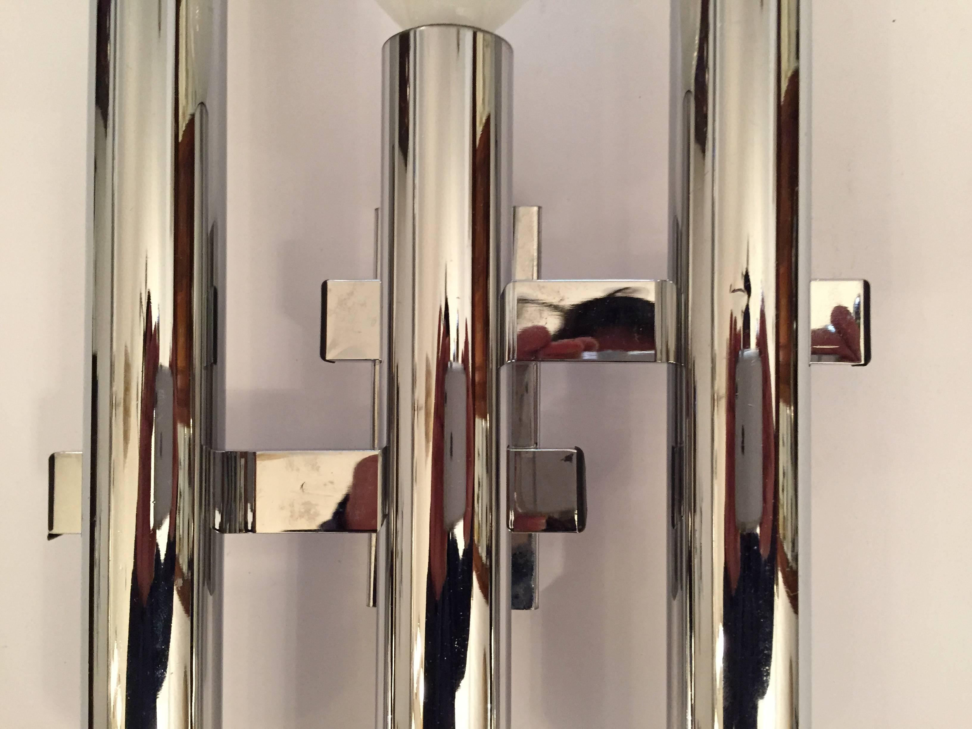 A set of four 1960s Italian polished chrome sconces by the famed lighting company. Sciolari. Rewired with back plates. Three-light sources each.