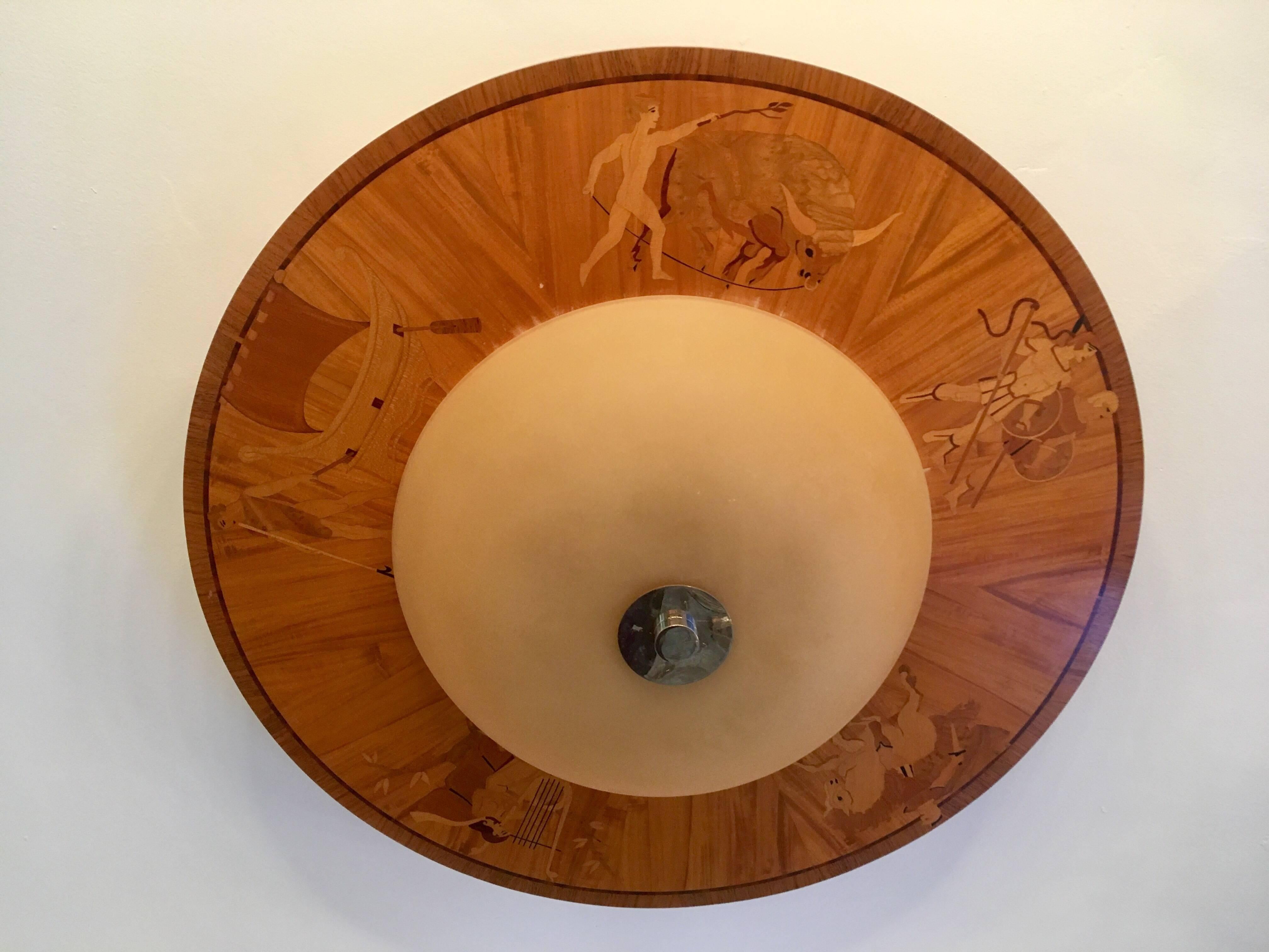 A large original 1920s Swedish pendant or flush ceiling light composed of a inlaid wood decorated fixture with a frosted golden glass shade designed by Mjolby Intarsia . Newly Rewired. A second matching light available.