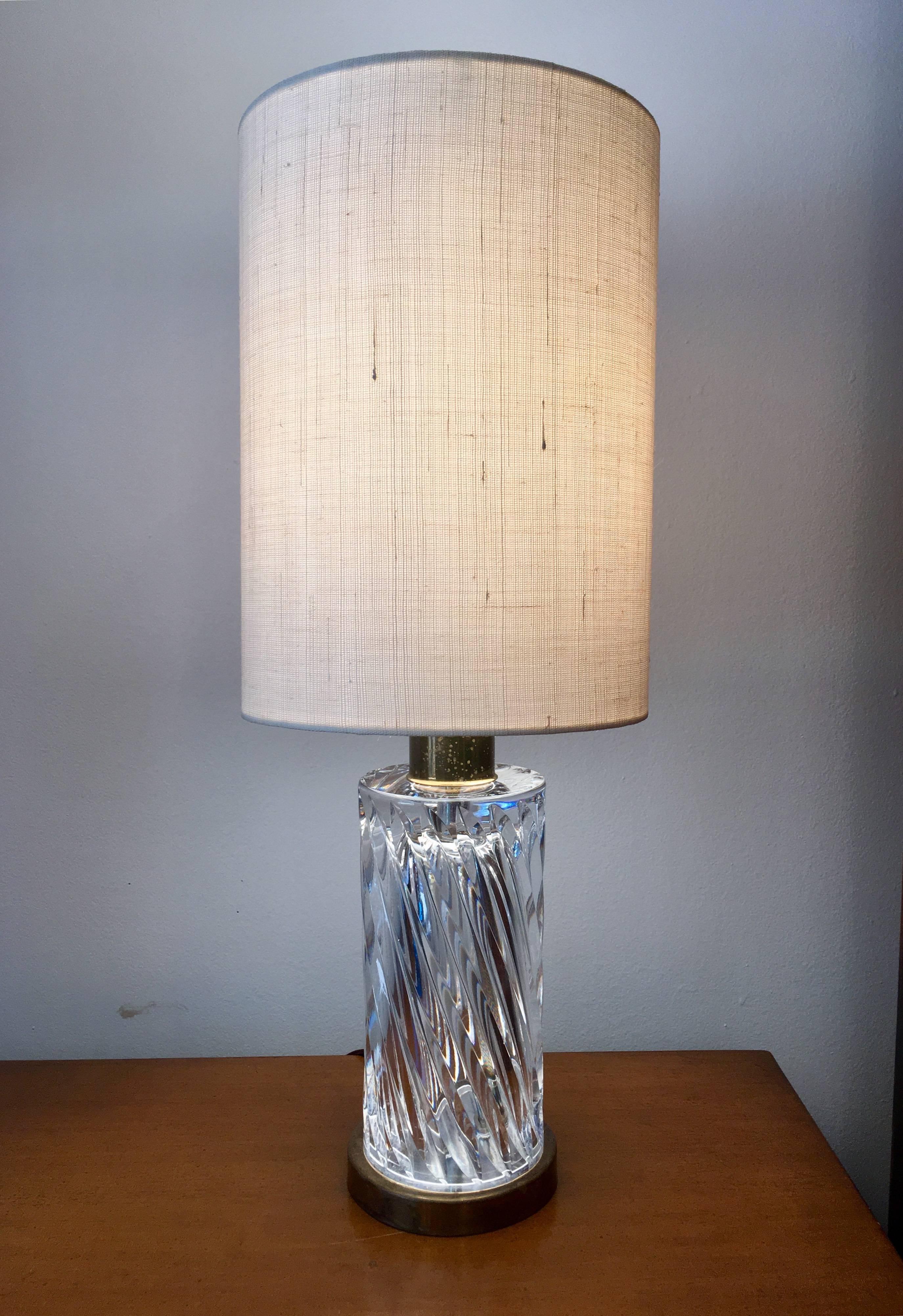 A wonderful pair of heavy clear crystal swirl pattern table lamps designed by Ollie Alberius for Orrefors. Newly rewired.