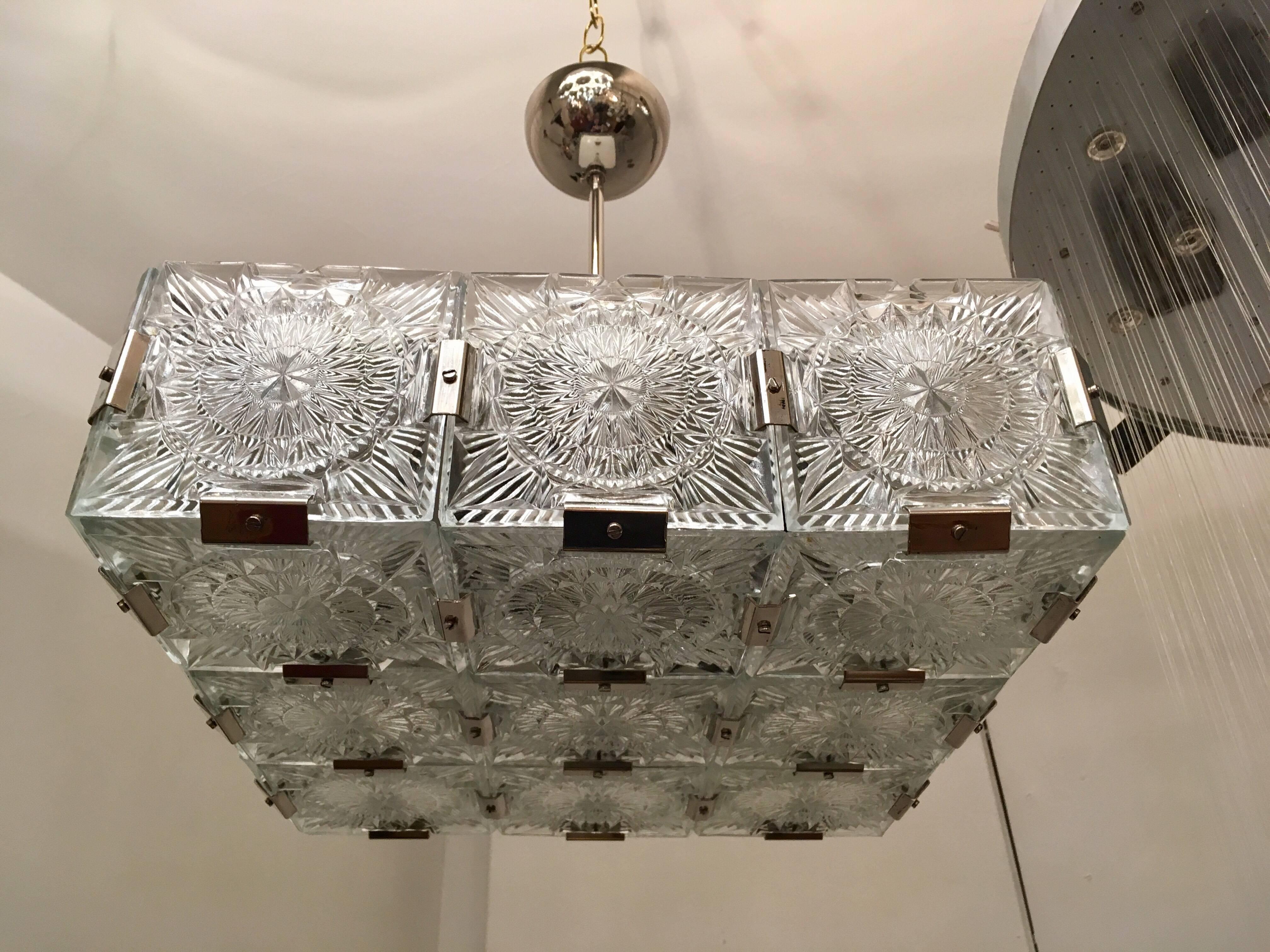 A 1960s Bohemian cut crystal pendant or flush ceiling light by Kamenicky Senov. The light is composed of thick textured paterned square cut fetal pieces with chrome fittings. Newly Rewired.