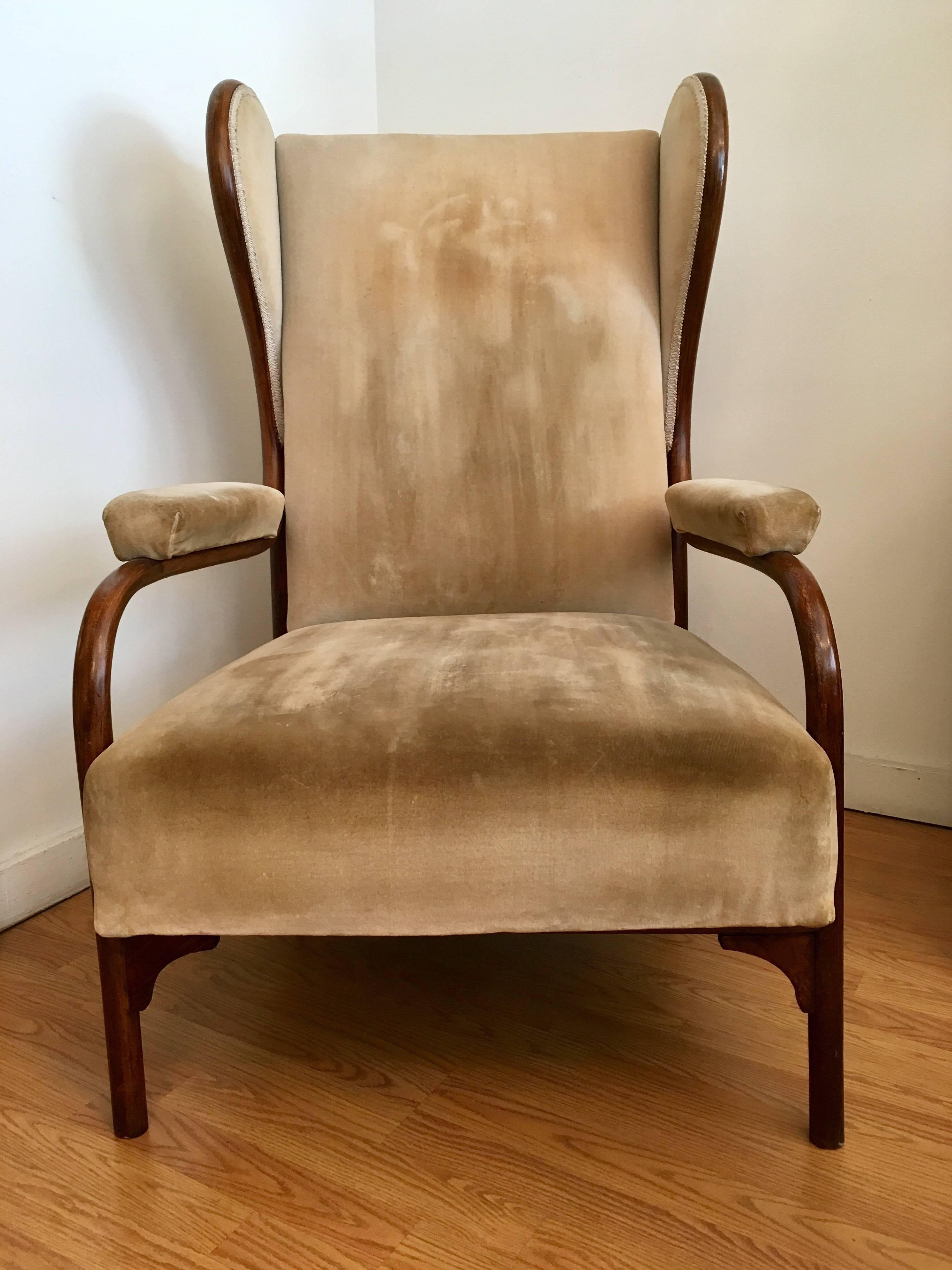 A rare model 6541 stained bent beechwood and upholstered velvet wing chair designed by Gebrüder Thonet in 1904. 
Factory label
Literature: Thonet factory catalog year 1904 page 121.

 