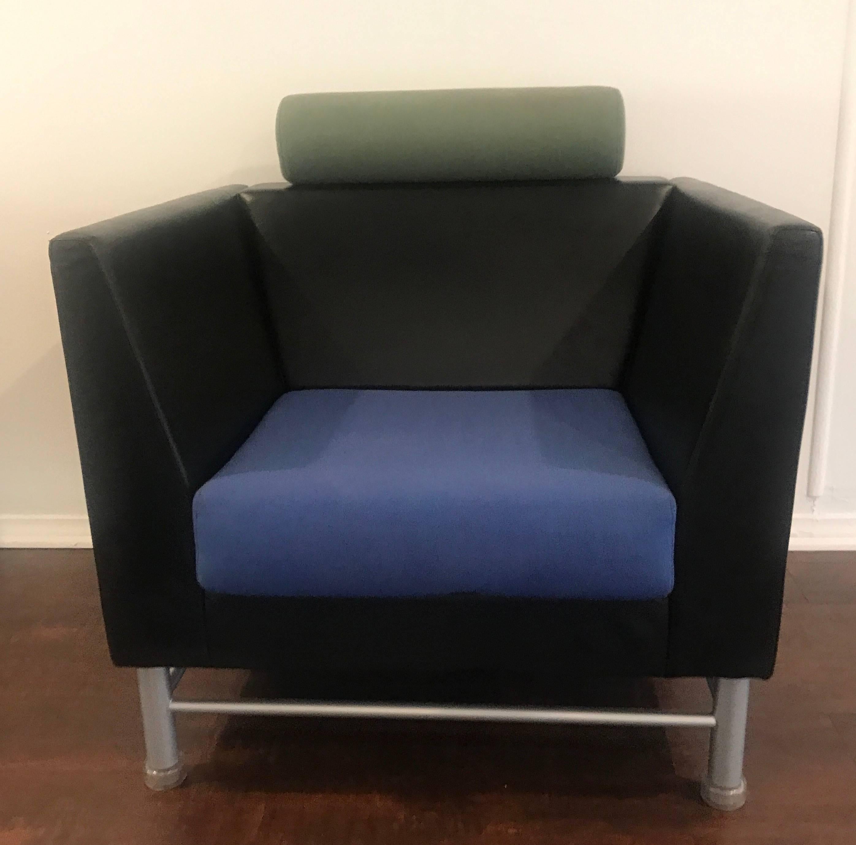 A rare pair of 1980s bold architectural Postmodern chairs designed by the famed Italian architect, Ettore Sottsass for Knoll. The comfortable cube chairs are in black leather with blue cotton seats and green cylinder head rests on grey enameled