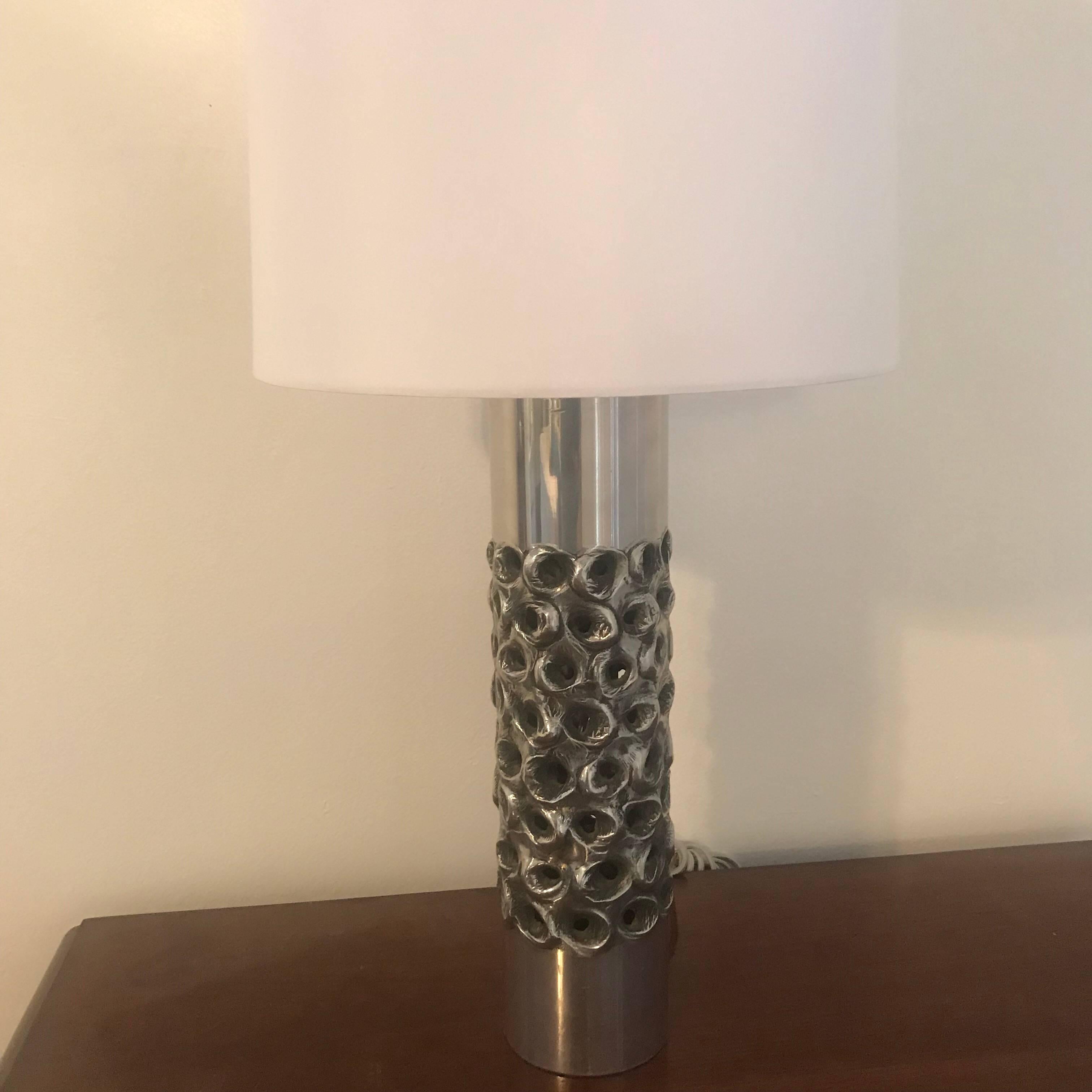 A wonderful Belgian sculptural 1970s chrome table lamp designed by W. Luyckx for Aluclair. Newly Rewired with a silver cloth cord and matching socket. A modern hand tucked silk shade included. Located in our New York City Chelsea location.