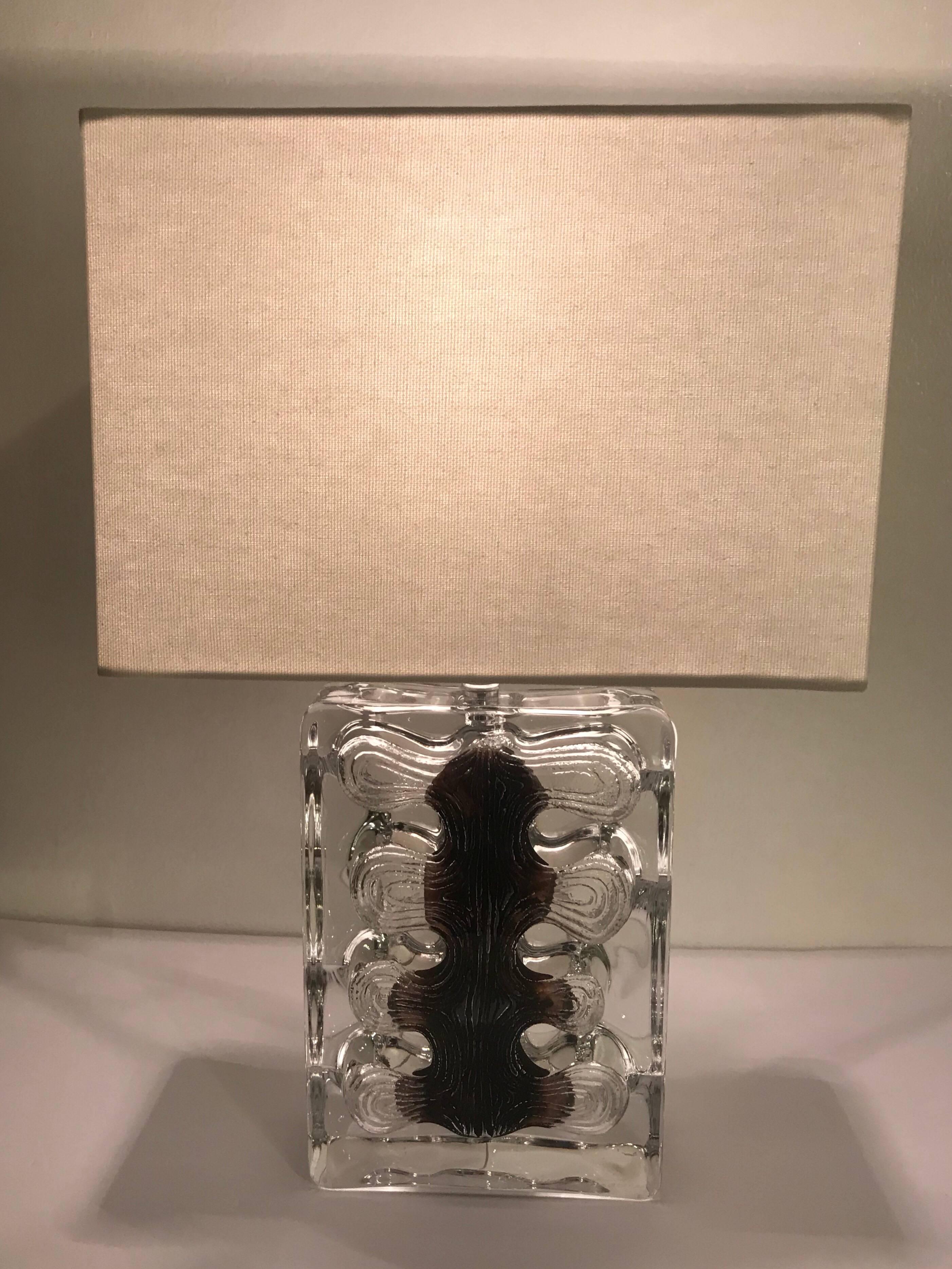 A luxurious 1970s solid thick French crystal fossil style table lamp with chrome fittings by the famed glass maker, Daum. Newly rewired with silk cord. Signed. 8” to top of the glass.

Daum (French, est. 1878) is a crystal and glass studio based in