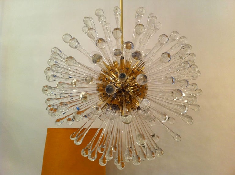 A beautiful brass and blown glass chandelier with over 160 glass elements. Twelve-light sources. Restored. Originally installed in an Italian resort. Rewired. A longer chain or pole provided if needed. Sold individually if needed.