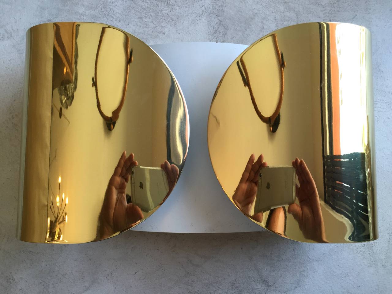 A sleek pair of Space-Ave Italian midcentury wall lights by Tobia Scarpa. The wall lights are composed of golden polished brass with white enamel on the inside. Rewired. Three pairs available.