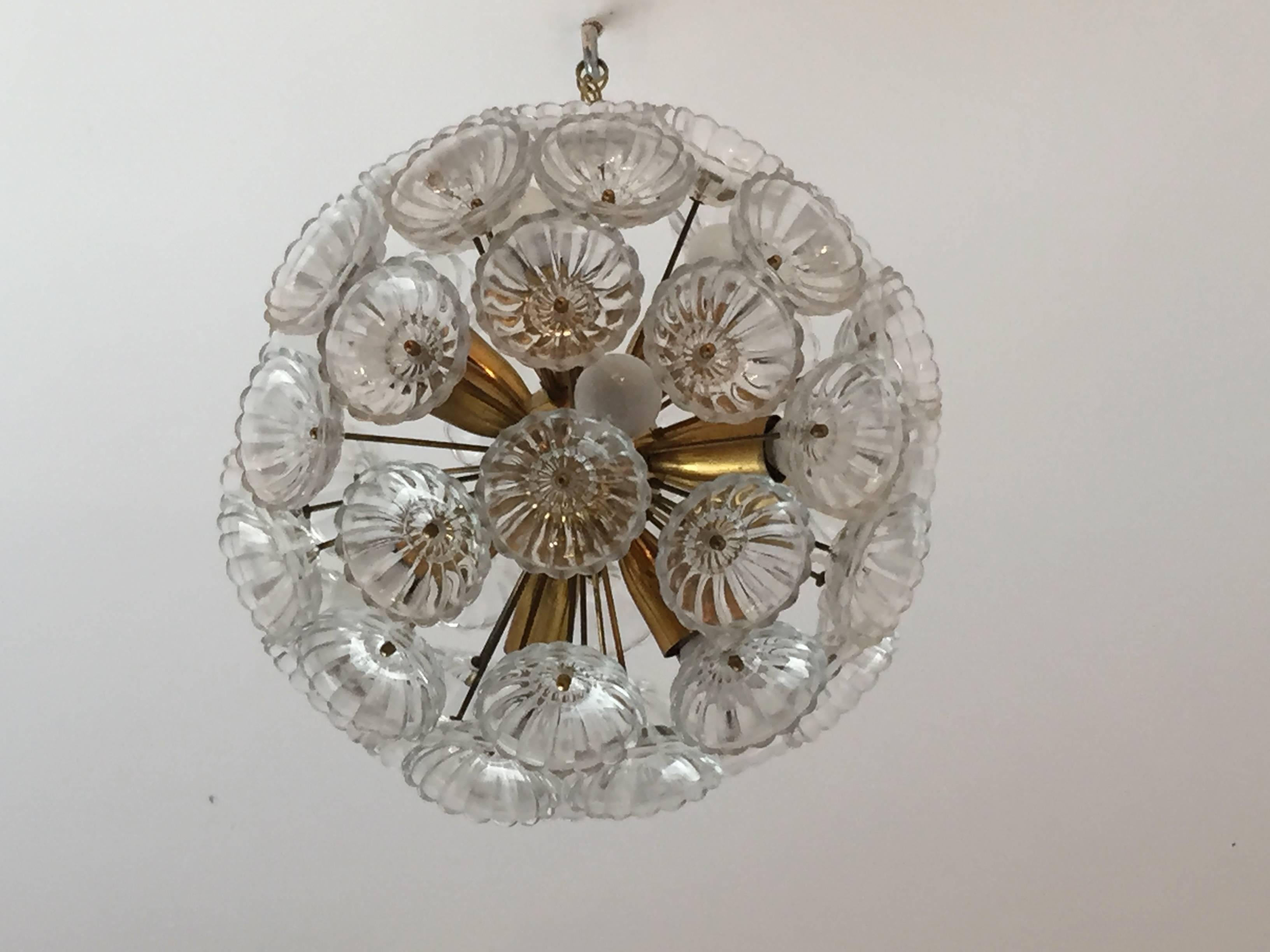 A wonderful 1950s Austrian golden brass chandelier with floral glass cup elements. Rewired. Ten light sources. We can drop it on a longer chain or pole.