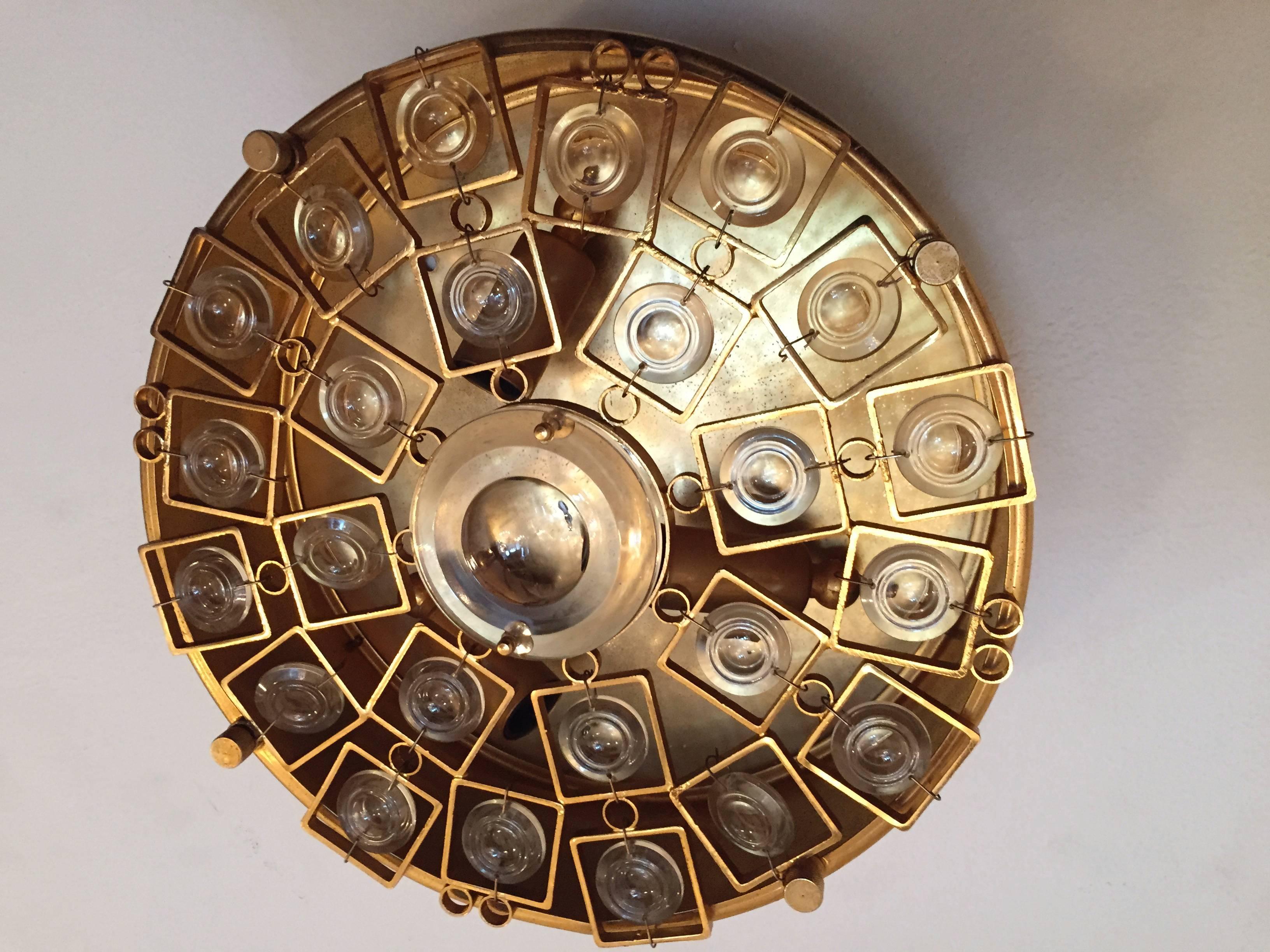 A luxurious Italian high style 1960s golden gilt flush ceiling light with large cut crystals by Oscar Torlasco for Stikronen. Rewired. Three light sources.
